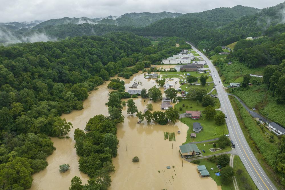 Home and structures are flooded near Quicksand, Ky., Thursday. Heavy rains have caused flash flooding and mudslides as storms pound parts of central Appalachia. Kentucky Gov. Andy Beshear says it's some of the worst flooding in state history.