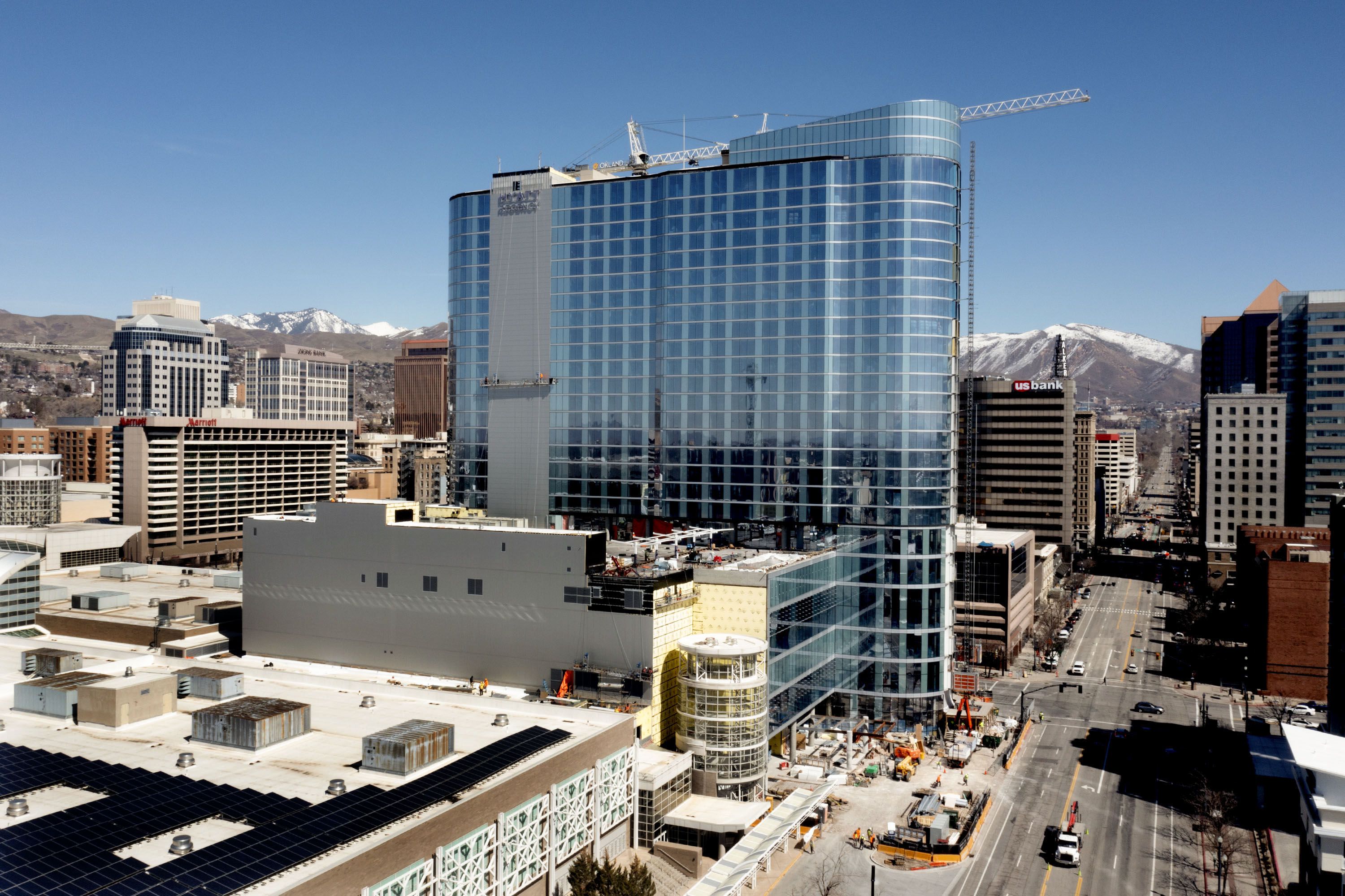 The Salt Palace Convention Center and the Hyatt Regency, which is under construction, are pictured in Salt Lake City on March 23. A professional medical and research ethics organization has canceled its planned convention in Salt Lake City due to recently passed legislation.
