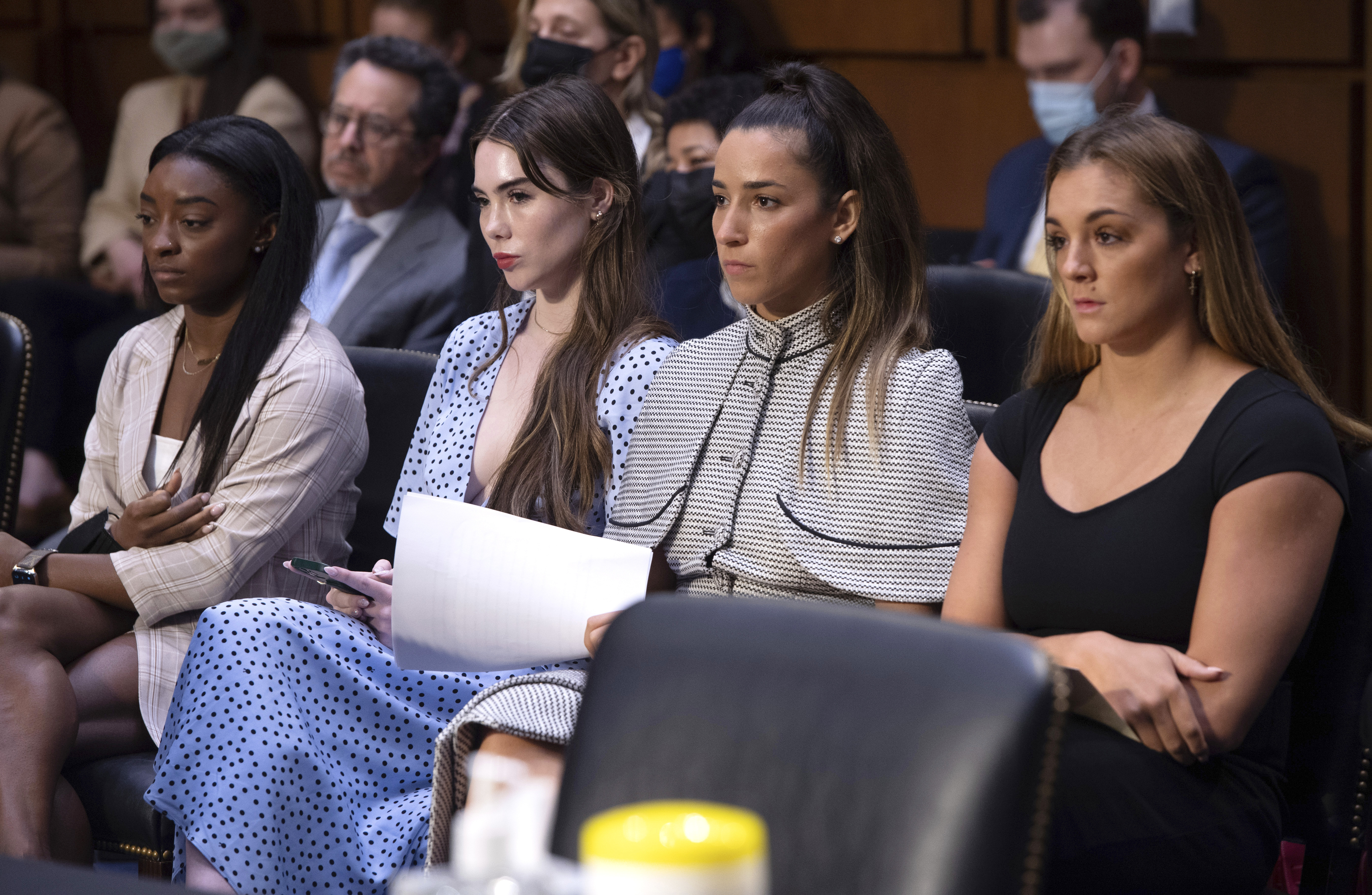 FILE - United States gymnasts from left, Simone Biles, McKayla Maroney, Aly Raisman and Maggie Nichols, arrive to testify during a Senate Judiciary hearing about the Inspector General's report on the FBI's handling of the Larry Nassar investigation on Capitol Hill, Sept. 15, 2021, in Washington. The FBI has reached out to attorneys representing Olympic gold medalist Simone Biles and other women who say they were sexually assaulted by Larry Nassar to begin settlement talks in the $1 billion claim they brought against the federal government, according to three people familiar with the matter. 