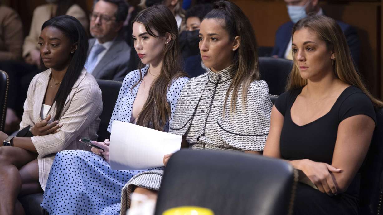 FILE - United States gymnasts from left, Simone Biles, McKayla Maroney, Aly Raisman and Maggie Nichols, arrive to testify during a Senate Judiciary hearing about the Inspector General's report on the FBI's handling of the Larry Nassar investigation on Capitol Hill, Sept. 15, 2021, in Washington. The FBI has reached out to attorneys representing Olympic gold medalist Simone Biles and other women who say they were sexually assaulted by Larry Nassar to begin settlement talks in the $1 billion claim they brought against the federal government, according to three people familiar with the matter.