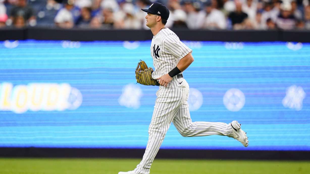 New York Yankees' Andrew Benintendi takes the field for the team's baseball game against his former team, the Kansas City Royals, Thursday, July 28, 2022, in New York.