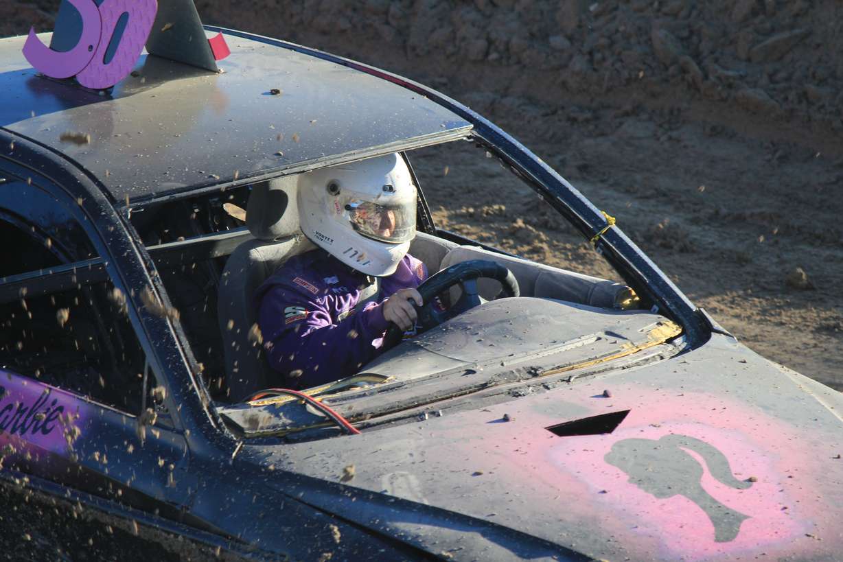 The mud flies into a drivers face at Trash Car Racing in Logan on July 16.