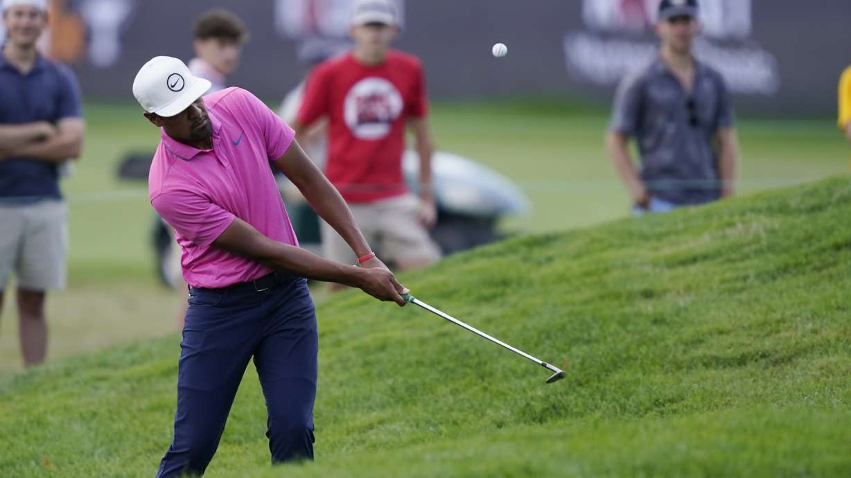 Tony Finau hits onto the sixth green during the second round of the Rocket Mortgage Classic golf tournament, Friday, July 29, 2022, in Detroit.