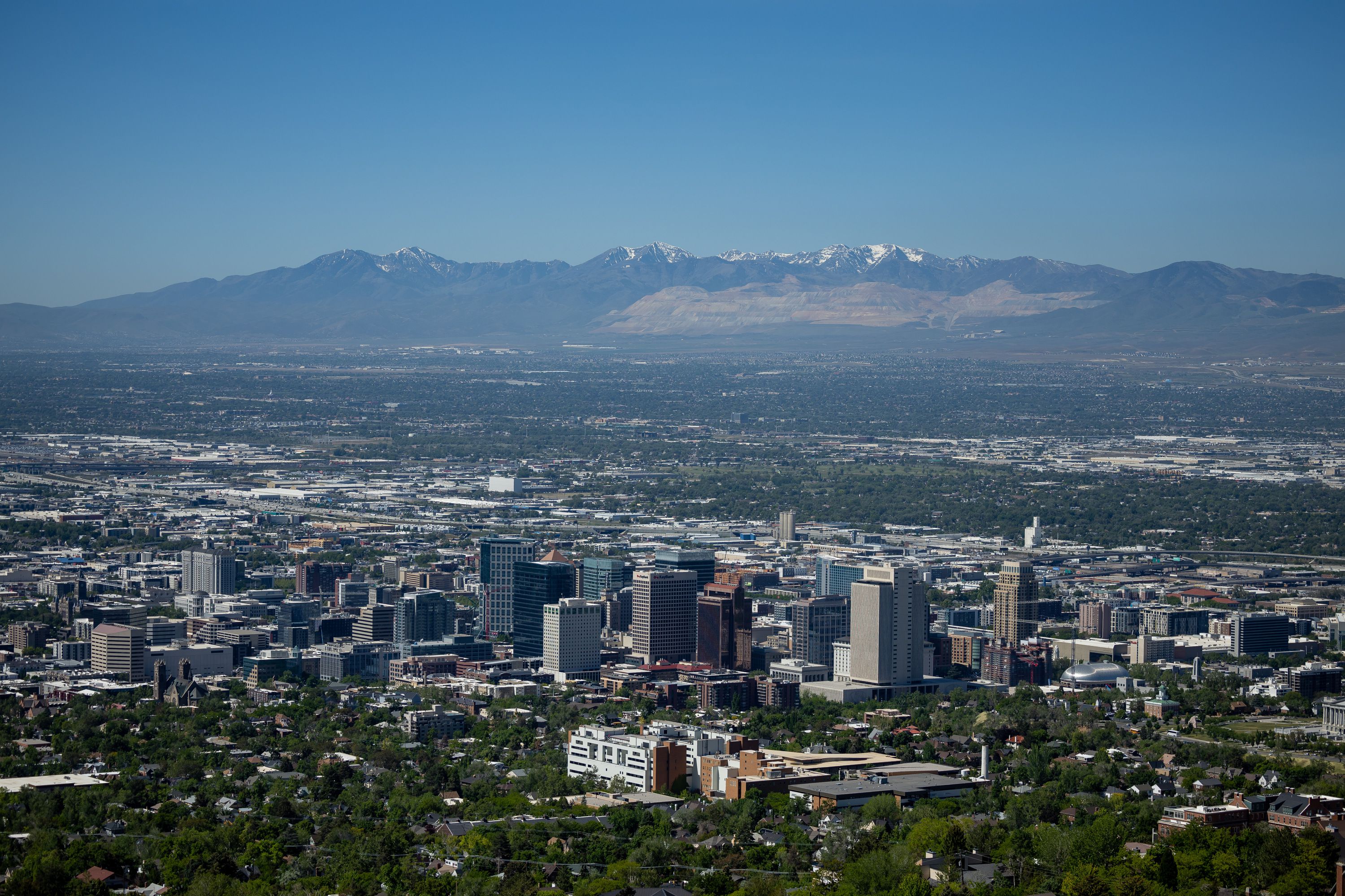 Downtown Salt Lake City and the Salt Lake Valley are pictured on June 2. For the first time in about two years, Utah has actually seen a small dip to its median home price. 