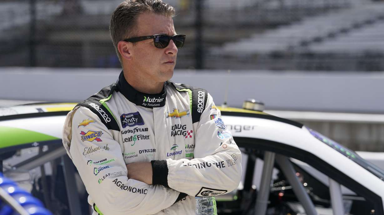 AJ Allmendinger looks on during qualifications for a NASCAR Xfinity Series auto race at Indianapolis Motor Speedway, Friday, July 29, 2022, in Indianapolis.