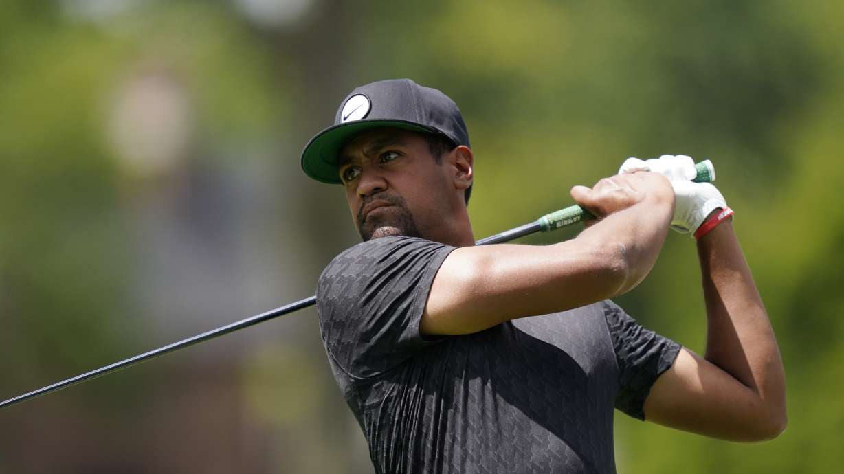 Tony Finau drives off the second tee during the third round of the Rocket Mortgage Classic golf tournament, Saturday, July 30, 2022, in Detroit.