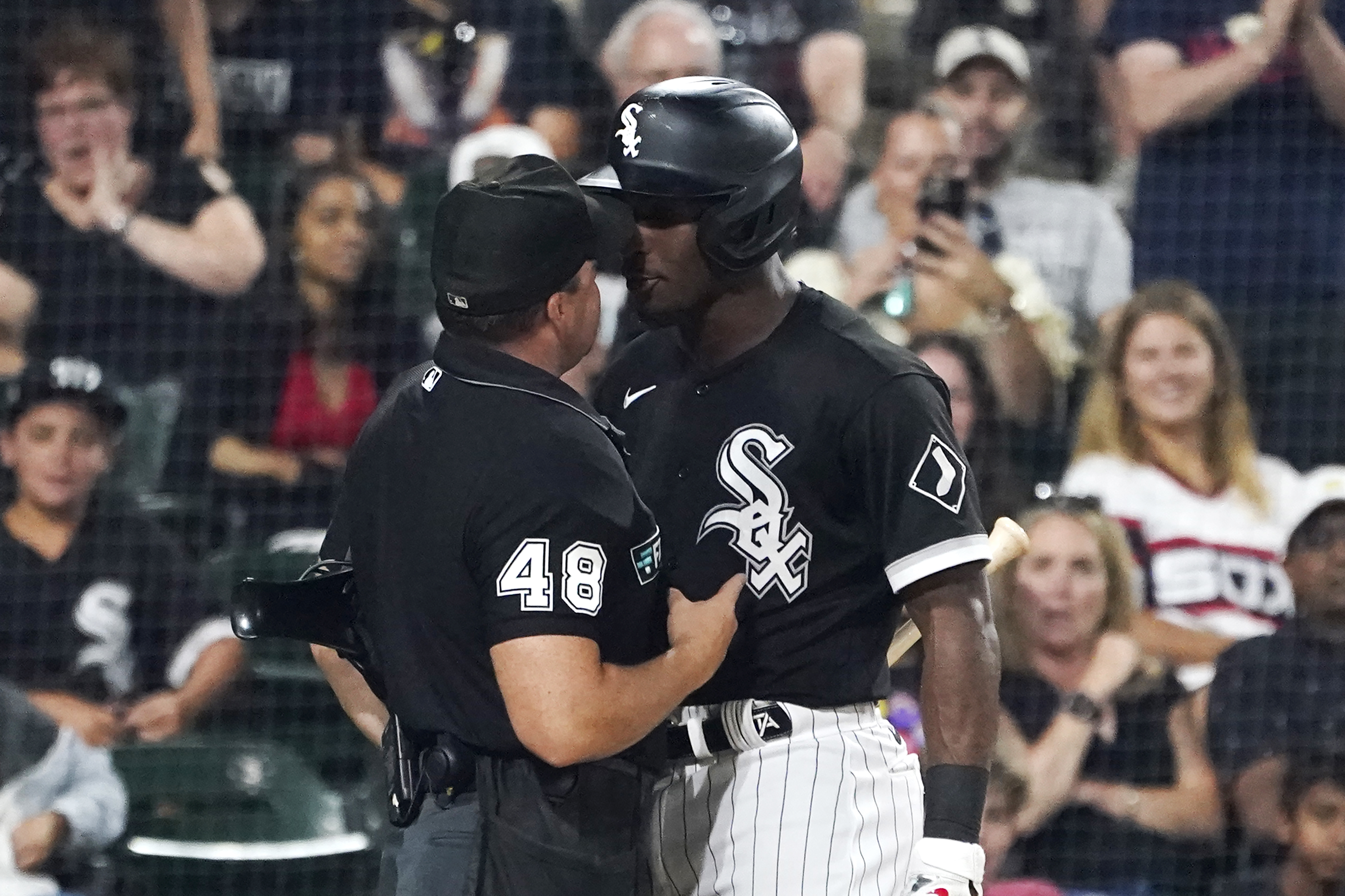 Chicago White Sox's Tim Anderson, right, gets in the face of home plate umpire Nick Mahrley after Anderson made contact with Mahrley during the seventh inning of a baseball game against the Oakland Athletics on Friday, July 29, 2022, in Chicago. Anderson was ejected. 
