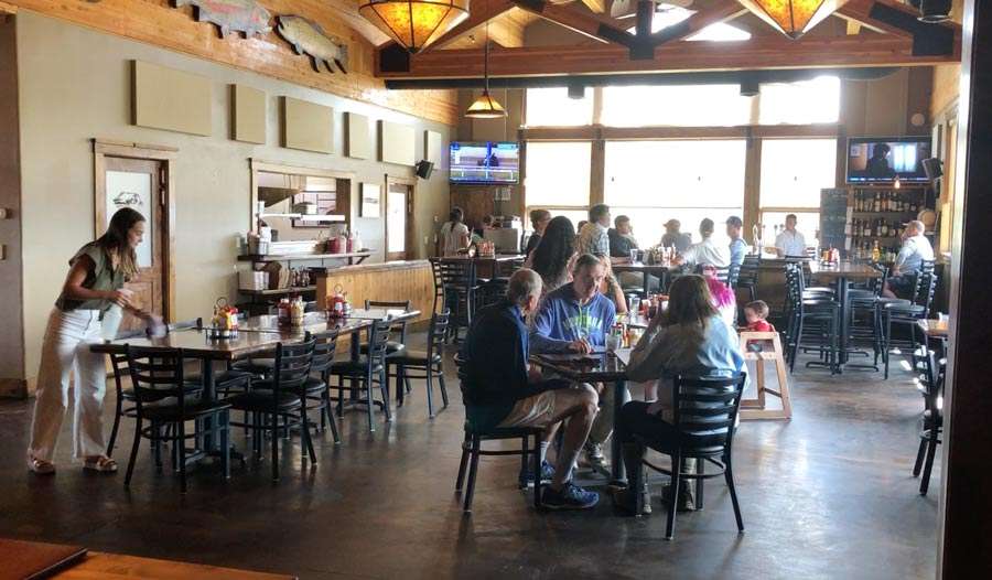 Customers enjoying a bite to eat at Trouthunter Bar and Grill in Island Park Wednesday afternoon.