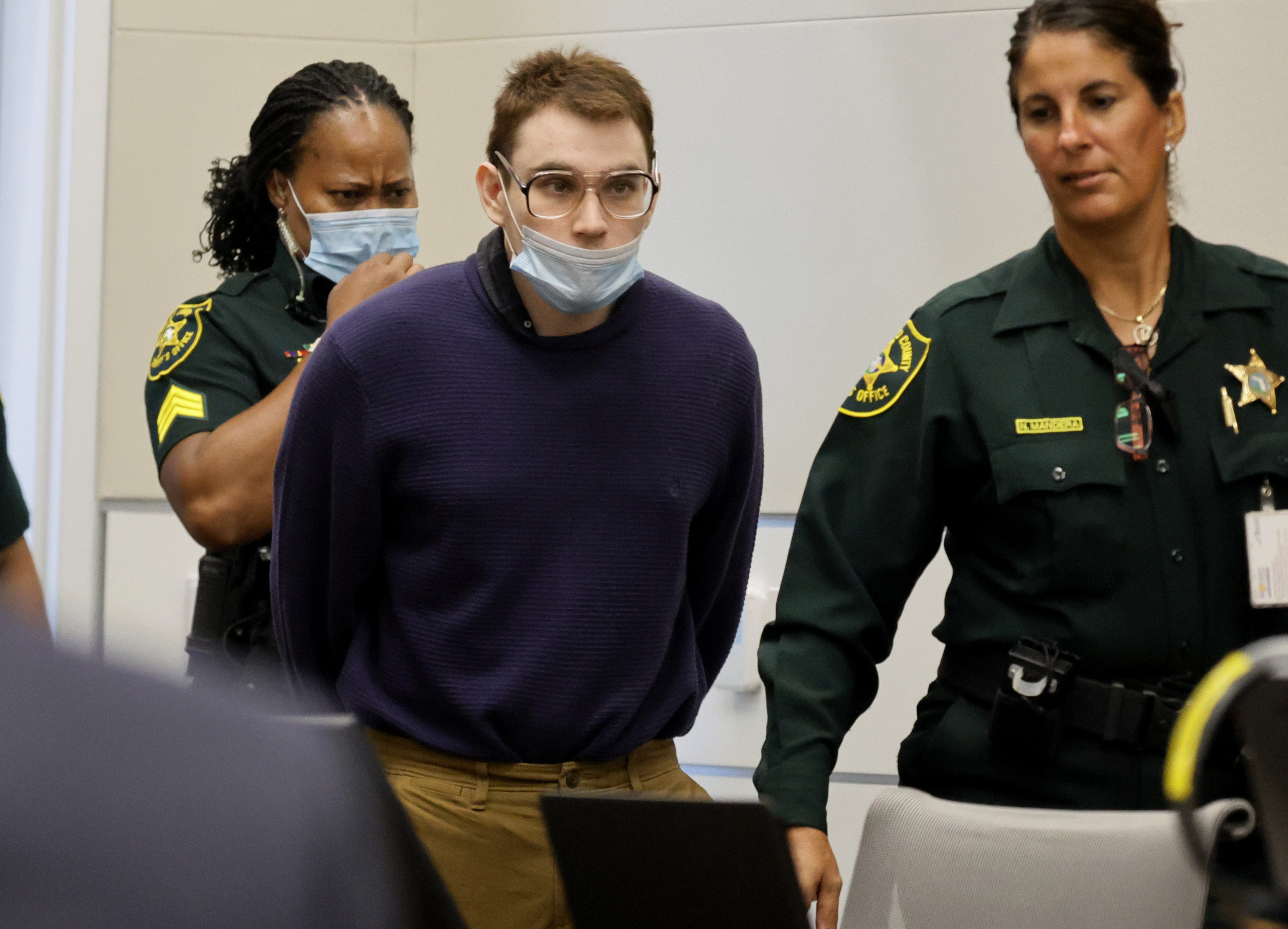 Marjory Stoneman Douglas High School shooter Nikolas Cruz is led into the courtroom during the penalty phase of his trial at the Broward County Courthouse in Fort Lauderdale, Fla., on Monday, July 25.