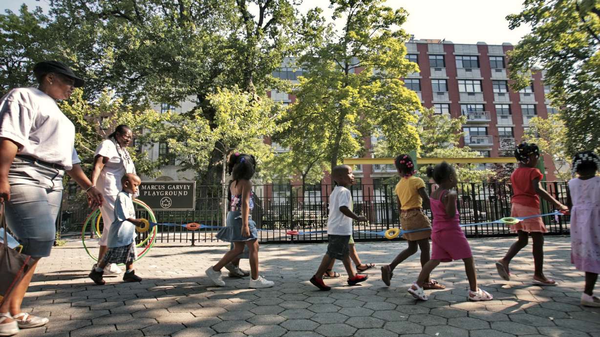 Children from a nearby daycare are escorted in Marcus Garvey Park in the Harlem neighborhood of New York Wednesday, Aug. 1, 2007. Some states have moved ahead with plans of their own to boost child care subsidies after a national effort by Democrats in Washington stalled. New York lawmakers passed a state budget in the spring that calls for it to spend $7 billion making child care more affordable over the next four years.