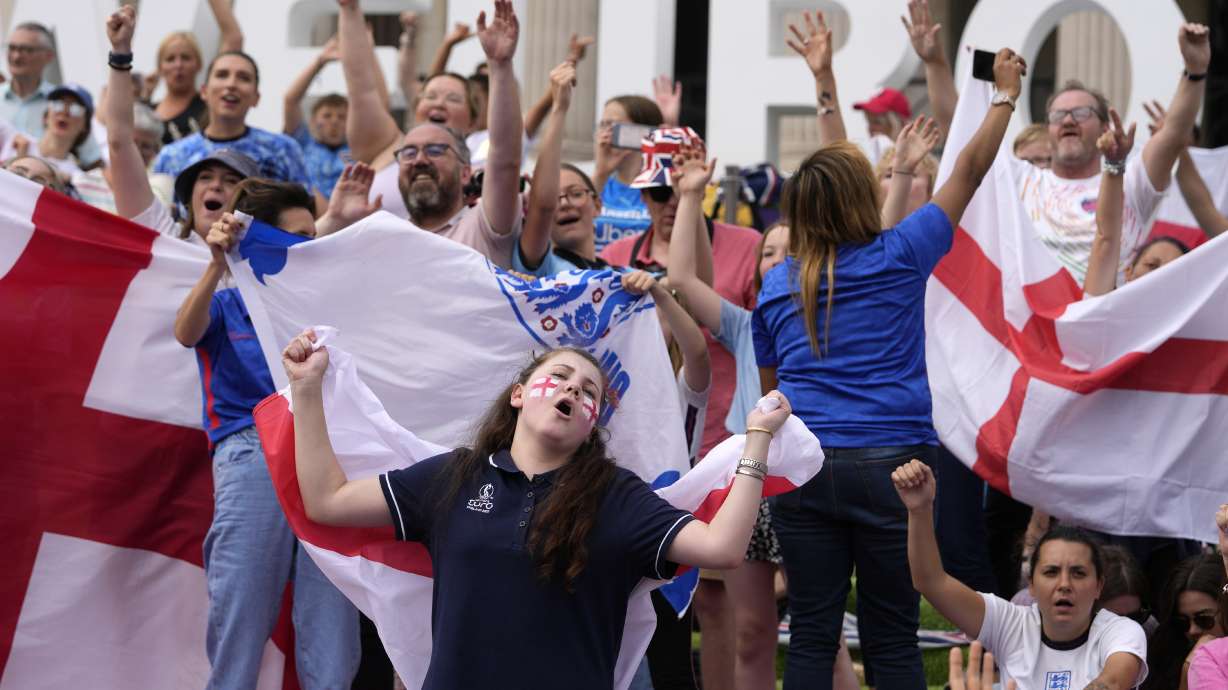 England supporters react as they gather in the fan zone in Trafalgar Square to watch on a big screen the final of the Women's Euro 2020 soccer match between England and Germany being played at Wembley stadium in London, Sunday, July 31, 2022.