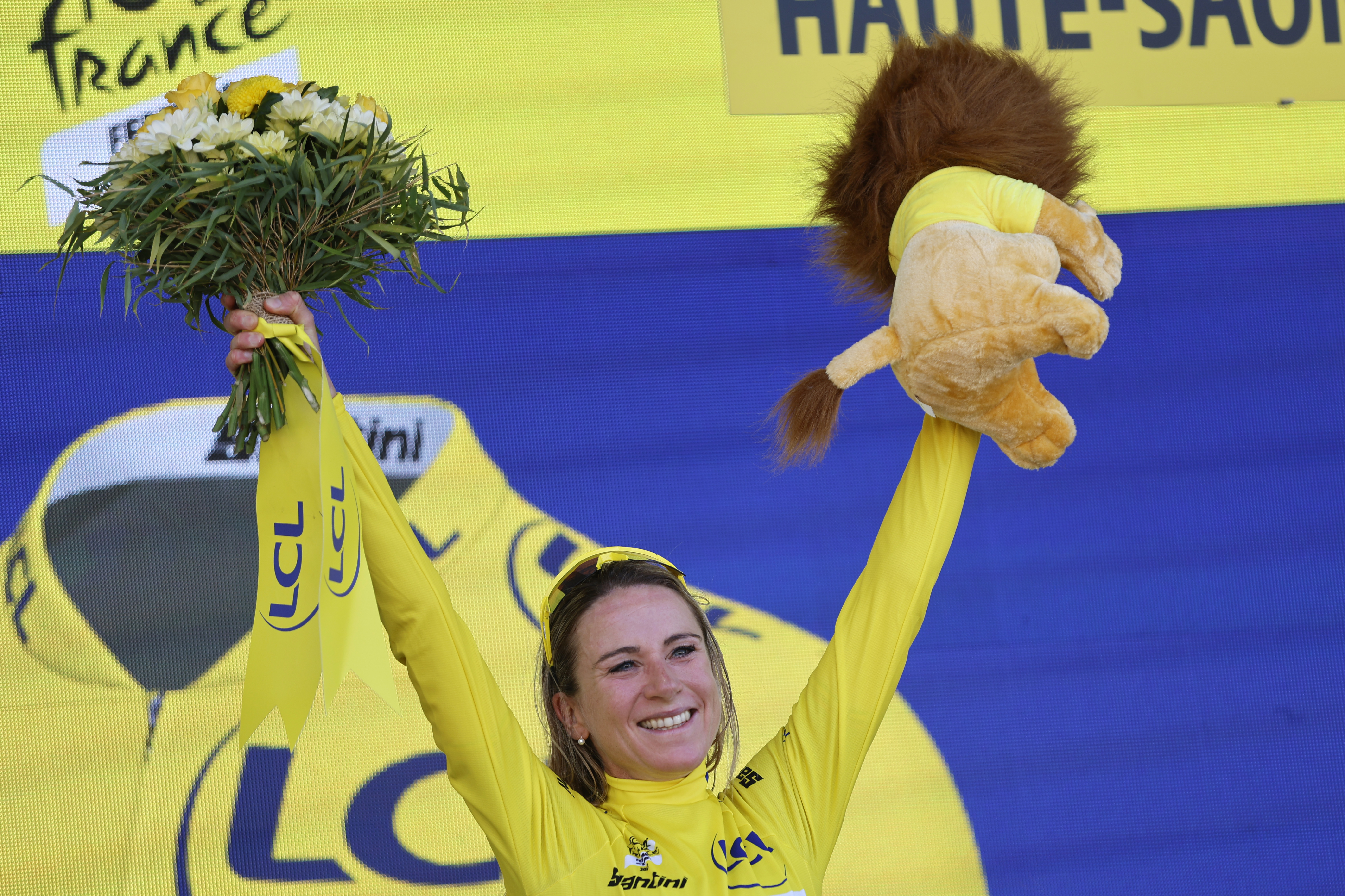 Netherland's Annemiek Van Vleuten, wearing the overall leader's yellow jersey, celebrates on the podium after winning the Tour de France women's cycling race, in La Super Planche des Belles Filles, eastern France, Sunday, July 31, 2022. 