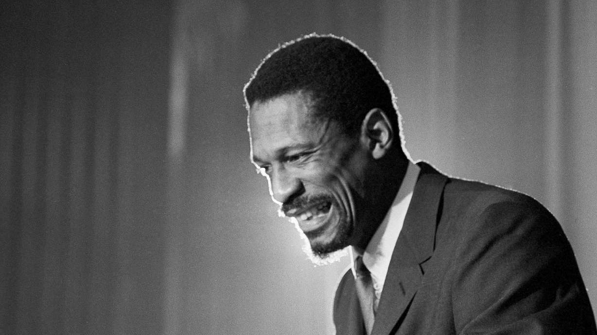 Bill Russell grins at announcement that he had been named coach of the Boston Celtics basketball team, April 18, 1966.