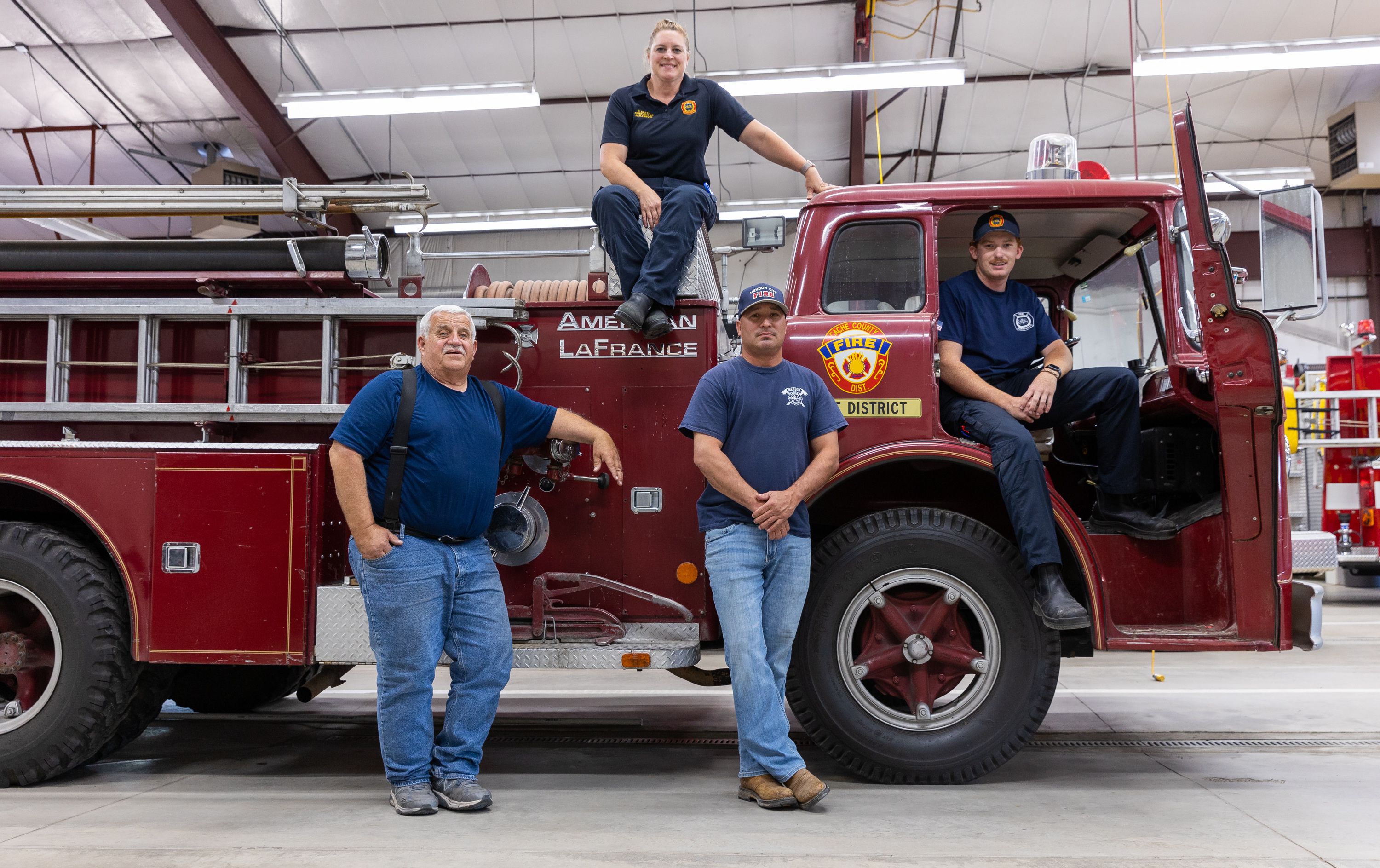 From left: Ray Olsen, Donelle Andersen, Joe Orduno and Jarom James pose around a vintage fire truck in Mendon, Cache County, on July 12. The truck is being auctioned off by the station in hopes to purchase new gear.