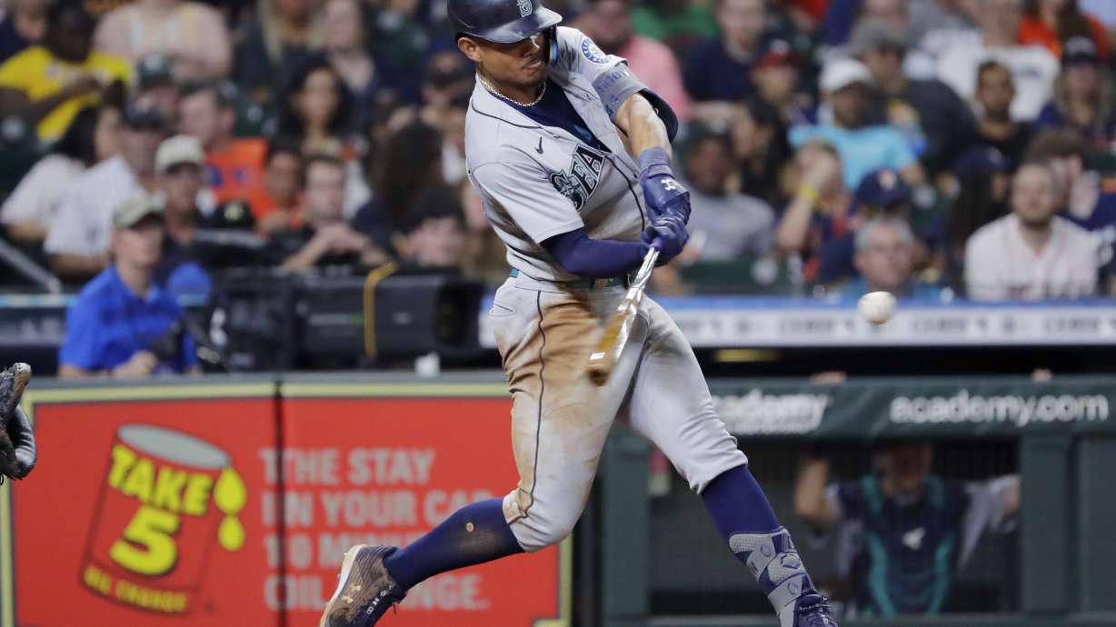 Seattle Mariners' Julio Rodriguez hits an RBI double against the Houston Astros during the eighth inning of a baseball game Friday, July 29, 2022, in Houston.
