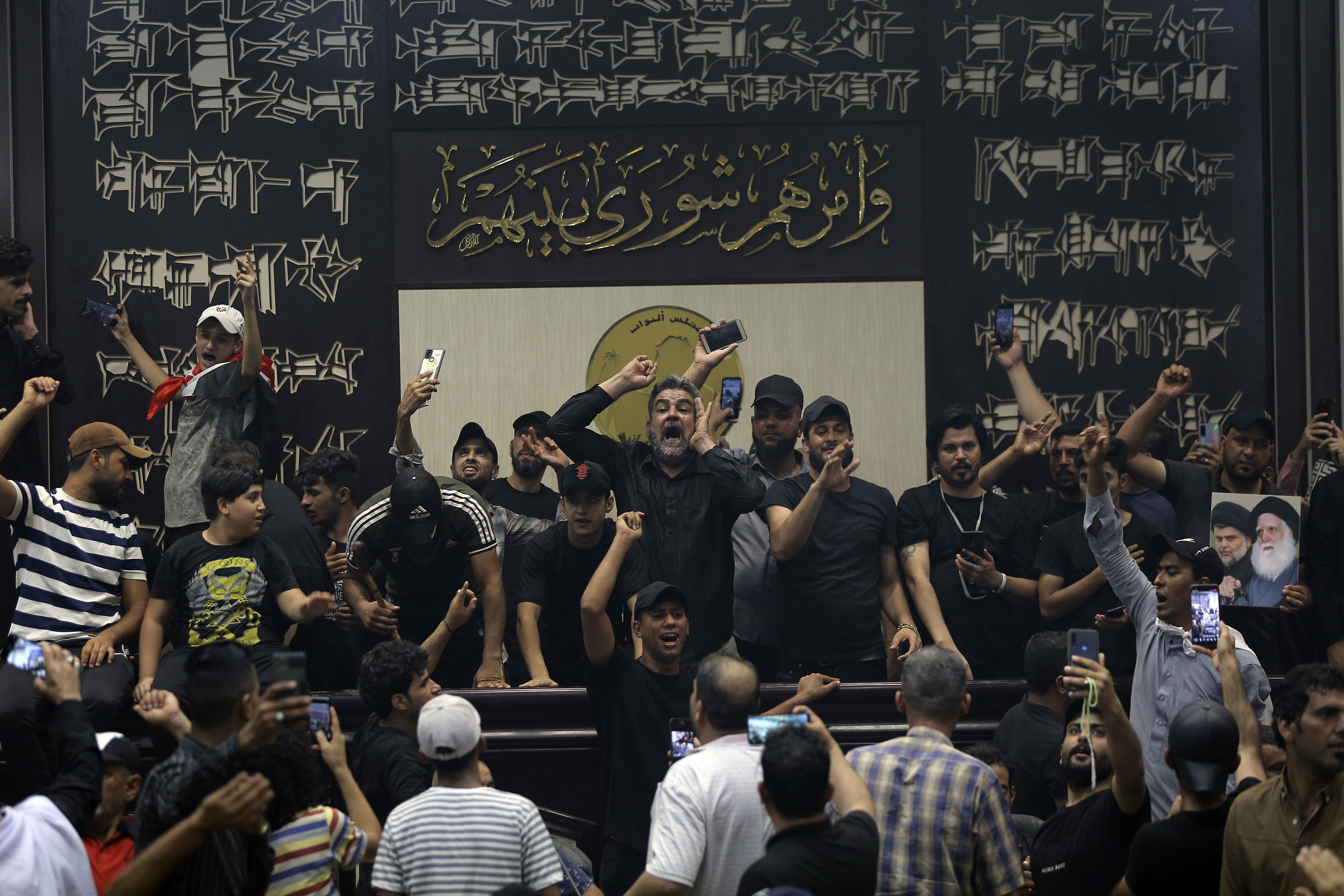 Iraqi protesters, mostly followers of Shiite cleric Muqtada al-Sadr, fill the parliament building in Baghdad, Iraq, Sunday.