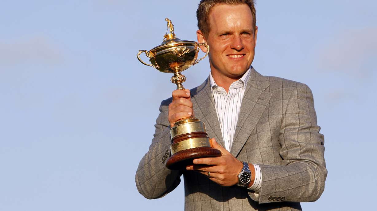 FILE - Europe's Luke Donald holds the Ryder Cup after Europe defeated the United States on the final day of the 2010 Ryder Cup golf matches at the Celtic Manor Resort in Newport, Wales, on Oct. 4, 2010. Donald has been selected Ryder Cup captain for Europe, taking over for Henrik Stenson after the Swede was stripped of the job for signing on with the Saudi-funded LIV Golf series.