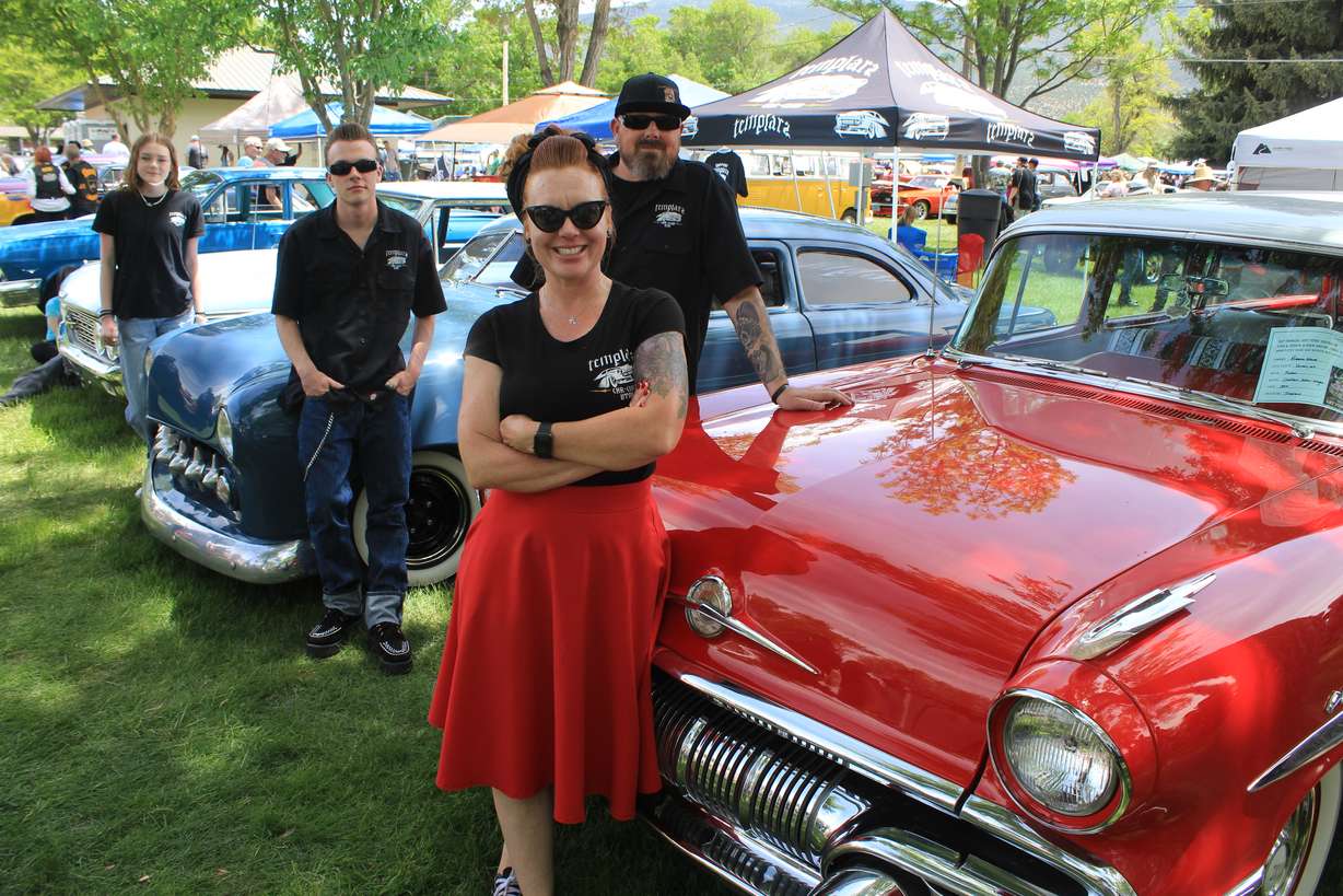 The Ward family at the 2022 Rat Fink Car Show in Manti with their cars: daughter Macey with her dad's 1962 Ford Galaxie, though she's looking for her own car, son Ian and his 1949 Ford, dad Devin, and mom Rebecca and her 1957 Pontiac Chieftain Safari Wagon.