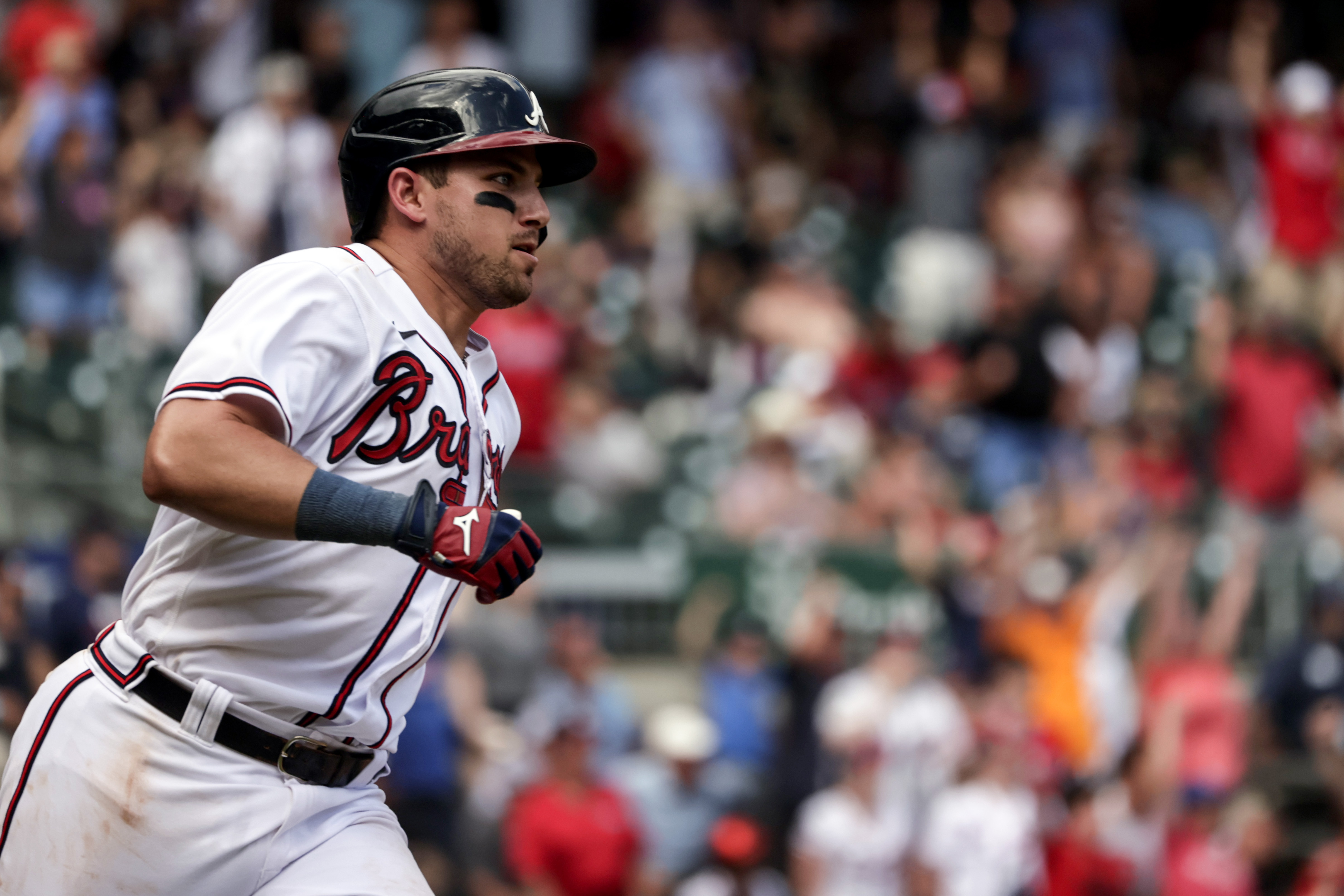 Atlanta Braves' Austin Riley runs to first on a game winning RBI during the ninth inning of a baseball game against the Arizona Diamondbacks, Sunday, July 31, 2022, in Atlanta. 