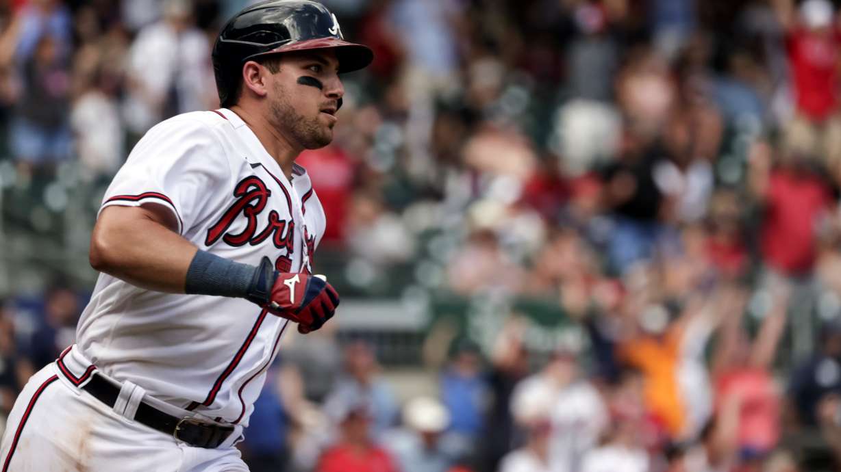 Atlanta Braves' Austin Riley runs to first on a game winning RBI during the ninth inning of a baseball game against the Arizona Diamondbacks, Sunday, July 31, 2022, in Atlanta.