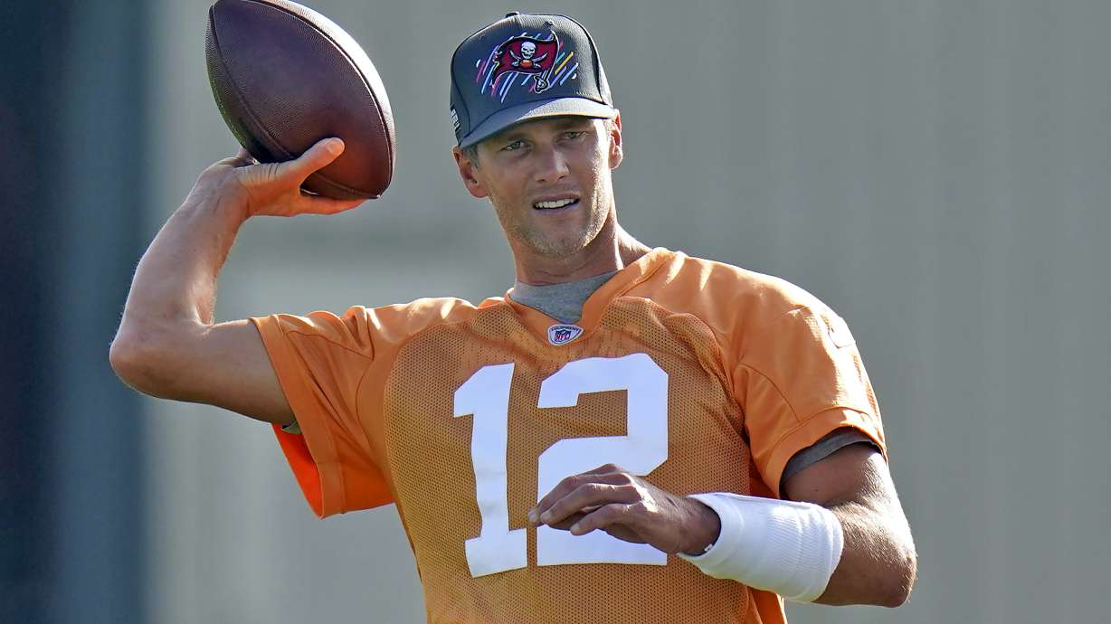 Tampa Bay Buccaneers quarterback Tom Brady throws a pass during NFL football training camp, Thursday, July 28, 2022, in Tampa, Fla.
