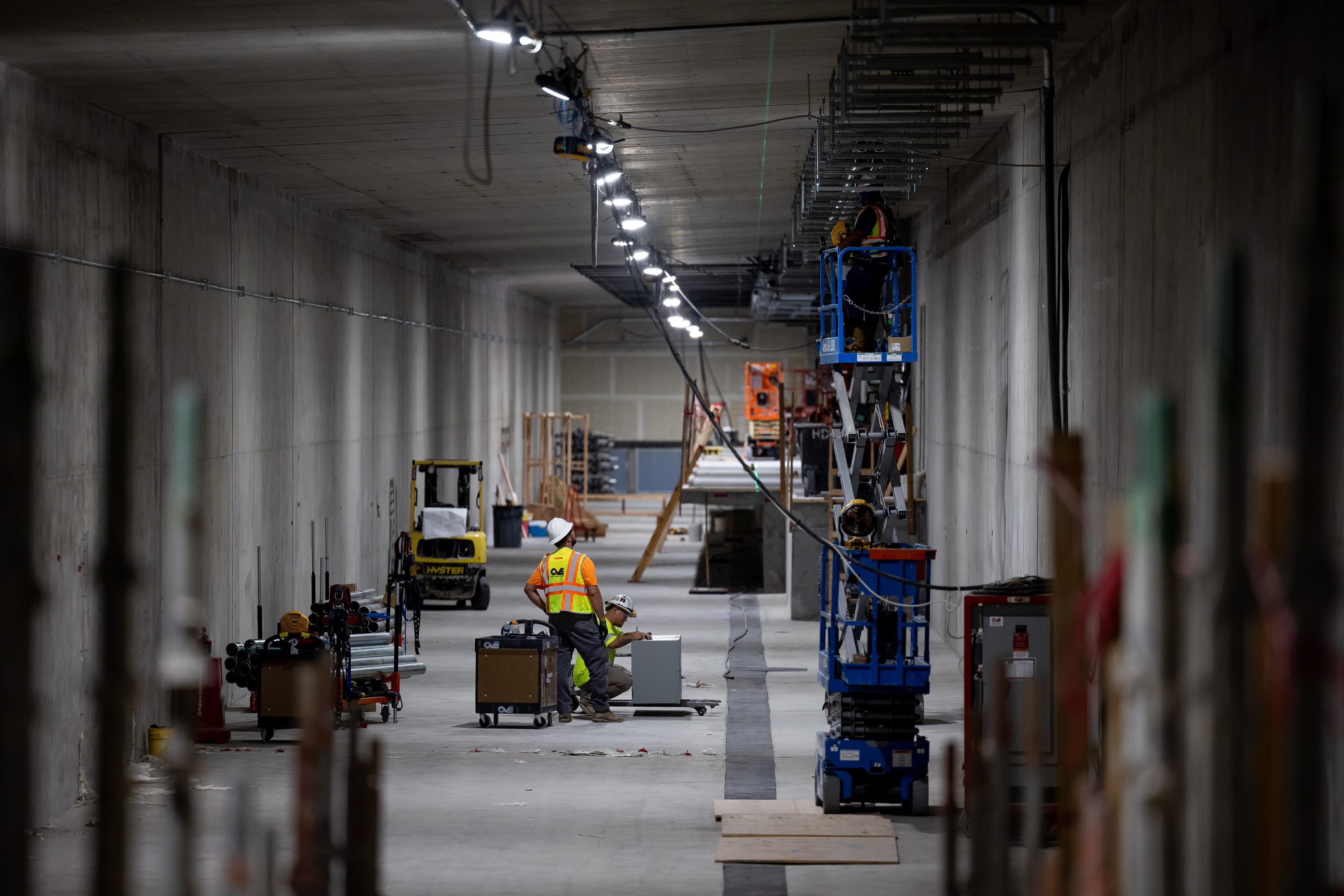 Crews work in a tunnels at the Salt Lake City International Airport in Salt Lake City on Aug. 2, 2022. Airport executives are seeking new bonds that will help finish the project by 2024. 