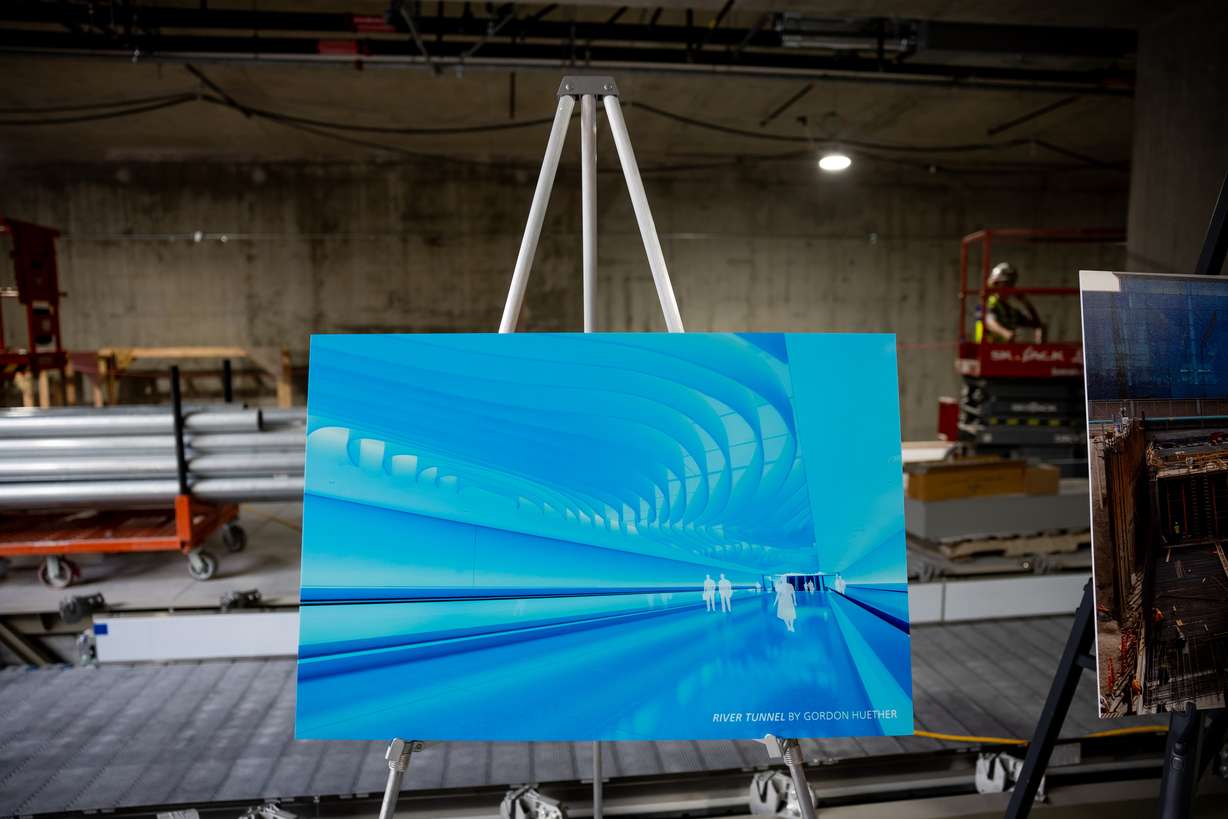 A rendering of “River Tunnel,” by Gordon Huether, is displayed inside the central tunnel, where the piece will be located, during a media tour at the Salt Lake City International Airport in Salt Lake City on Tuesday, Aug. 2, 2022. Once completed, the tunnel will open another way for passengers to transit between Concourse A and Concourse B and eventually to a future Concourse C.