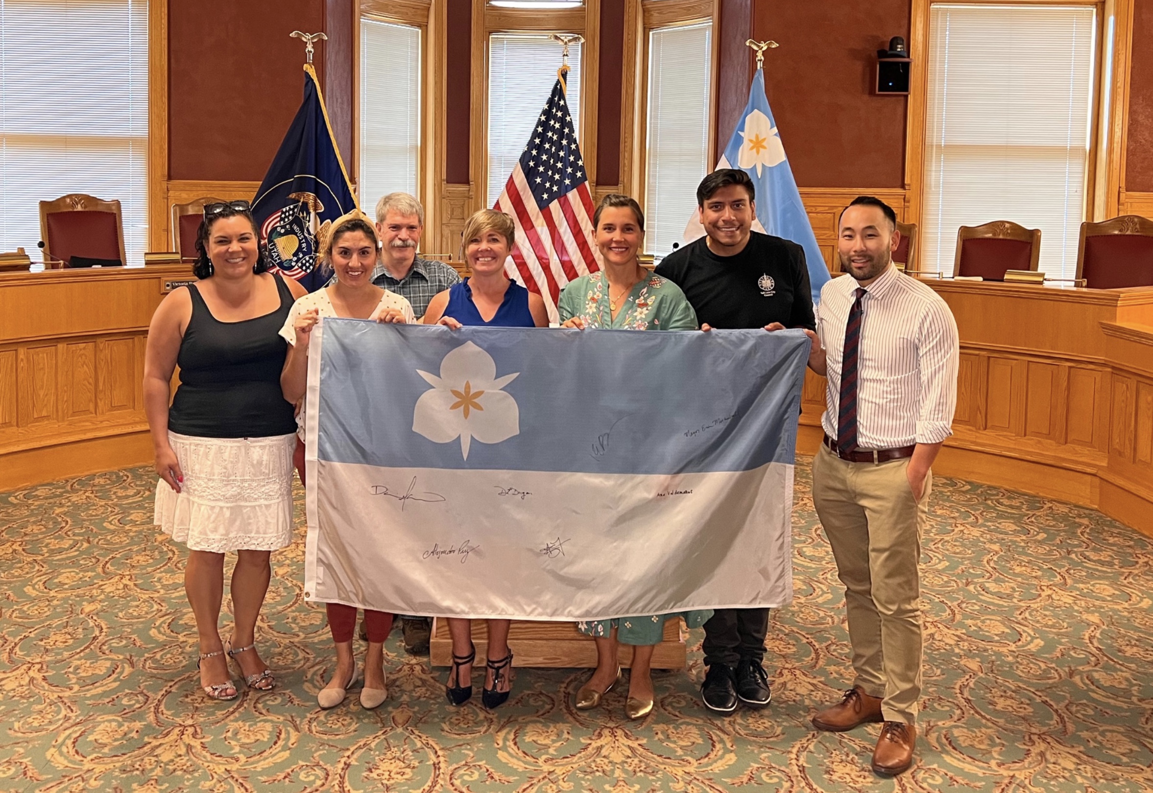 Salt Lake City Mayor Erin Mendenhall and other city leaders hold up a Salt Lake flag that will be sent to Chernivtsi, Ukraine, in a sign of support. Salt Lake City and Chernivtsi have been sister cities since 1989.