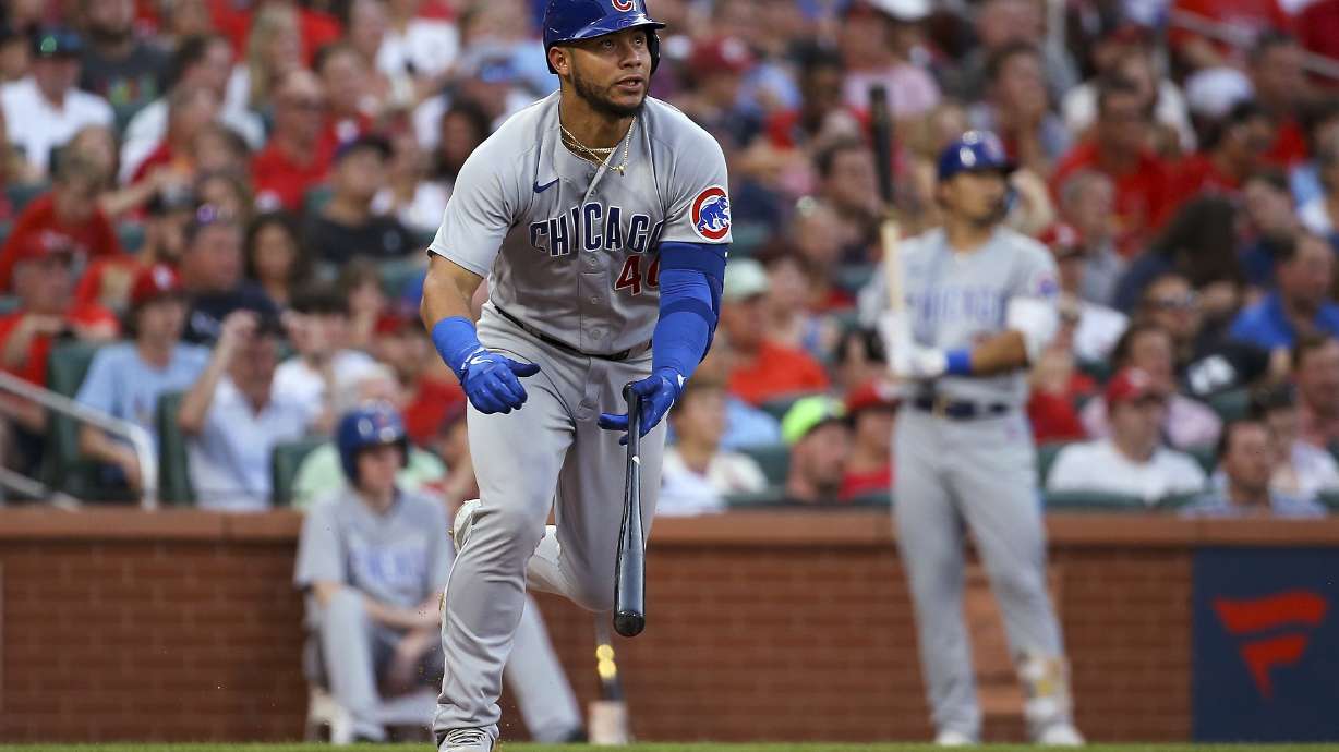 Chicago Cubs' Willson Contreras watches his triple against the St. Louis Cardinals during the third inning of a baseball game Tuesday, Aug. 2, 2022, in St. Louis.