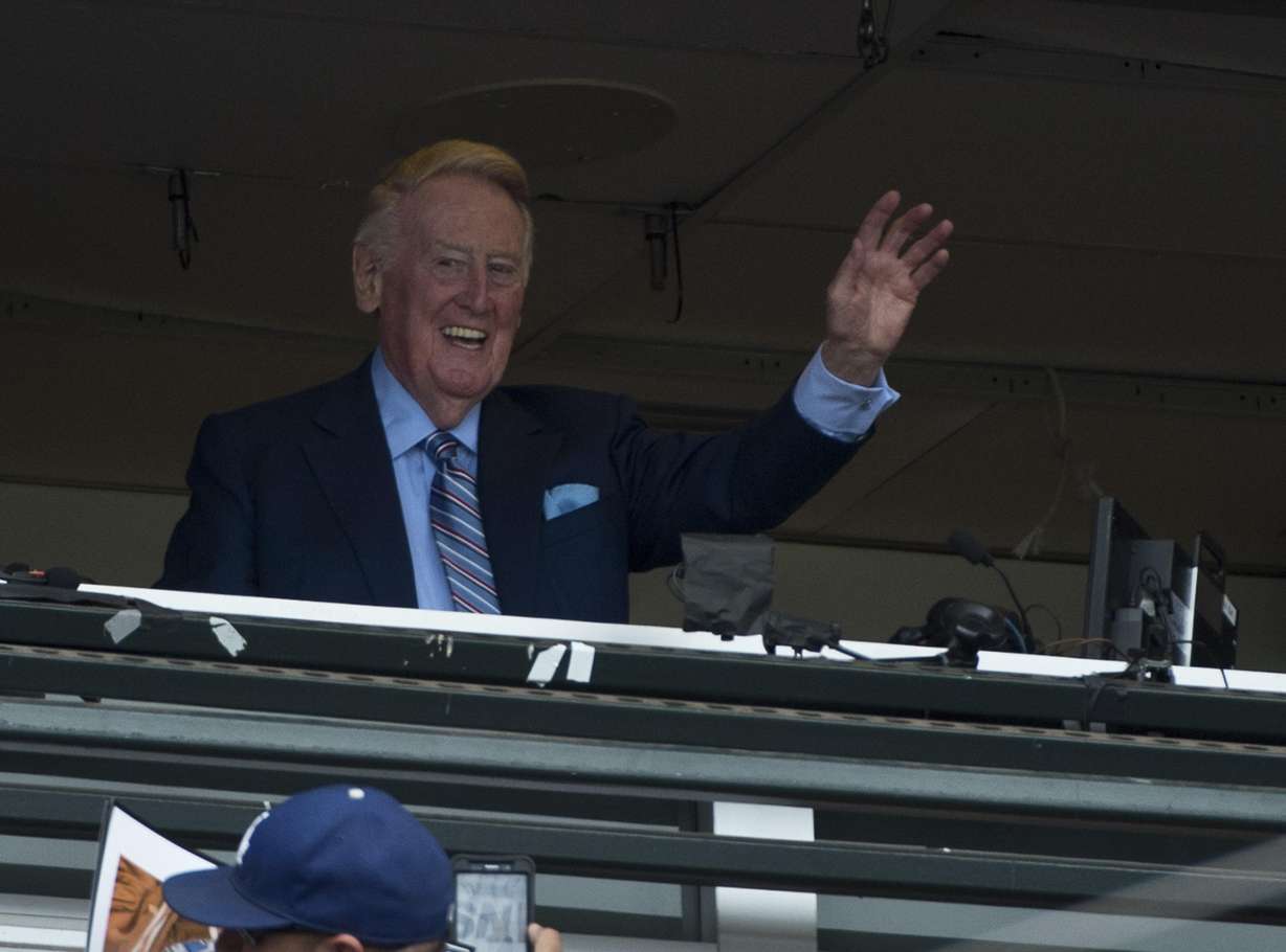 Vin Scully, voice of the Los Angeles Dodgers waves to the crowd before his final broadcast after 67 years, first Brooklyn and then Los Angeles Dodgers, at AT&T Park in San Francisco on October 2, 2016. Scully died on Tuesday.