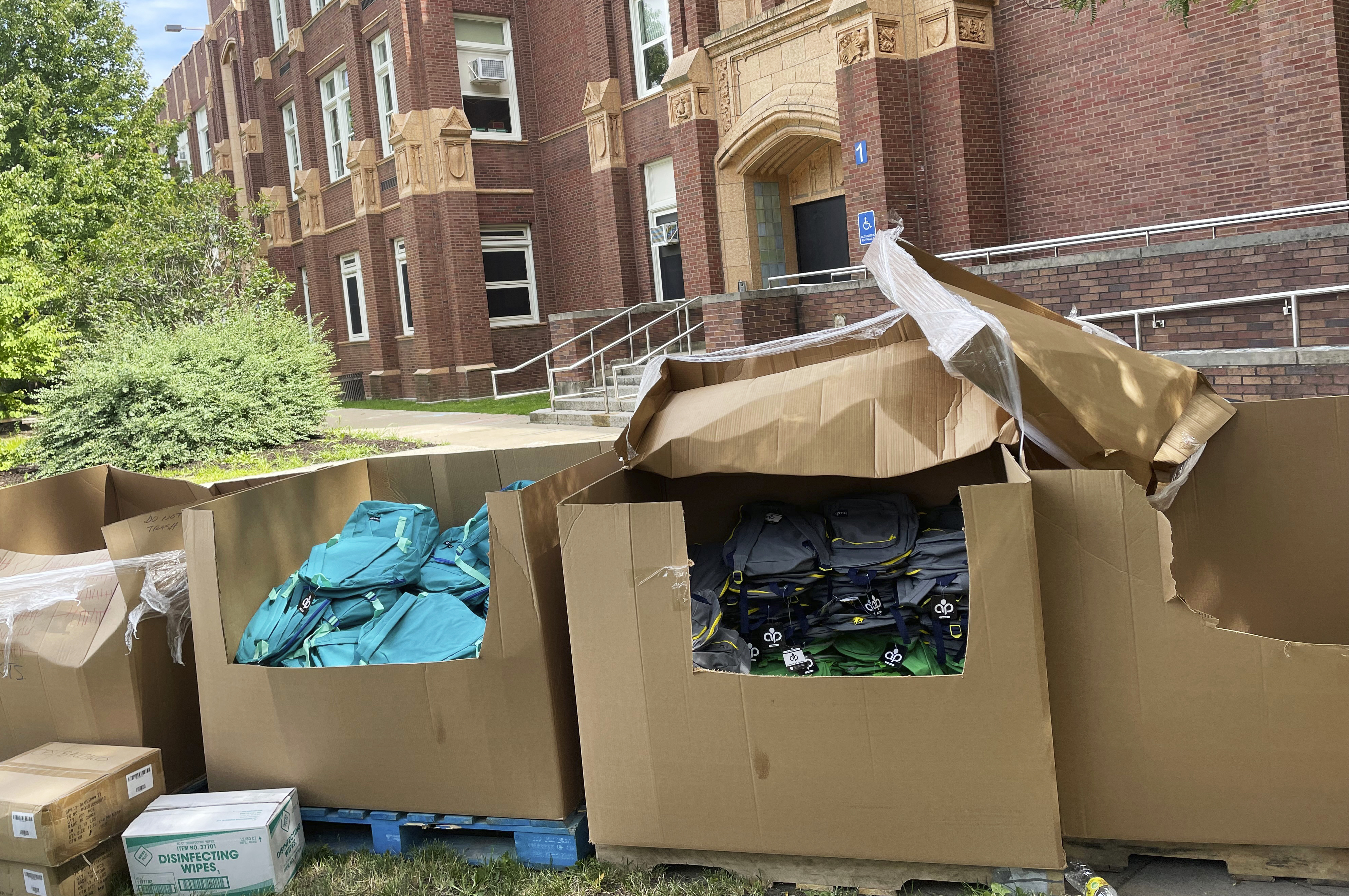 Backpacks and school supplies are unpacked at a Chicago Public Schools back-to-school supply giveaway at Theodore Roosevelt High School in Chicago, on July 22.