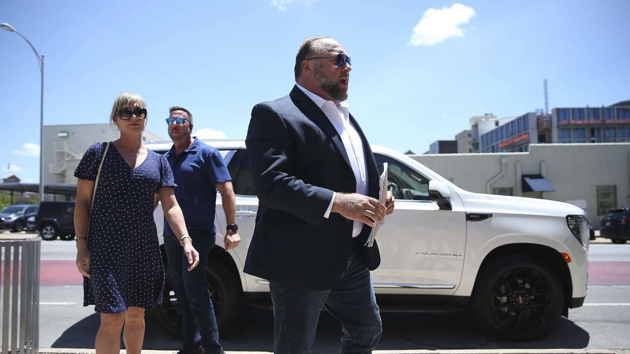 Alex Jones arrives at the Travis County Courthouse in Austin, Tuesday. Jones says he now understands it was irresponsible of him to declare the Sandy Hook Elementary School massacre a hoax and that he now believes it was "100% real."