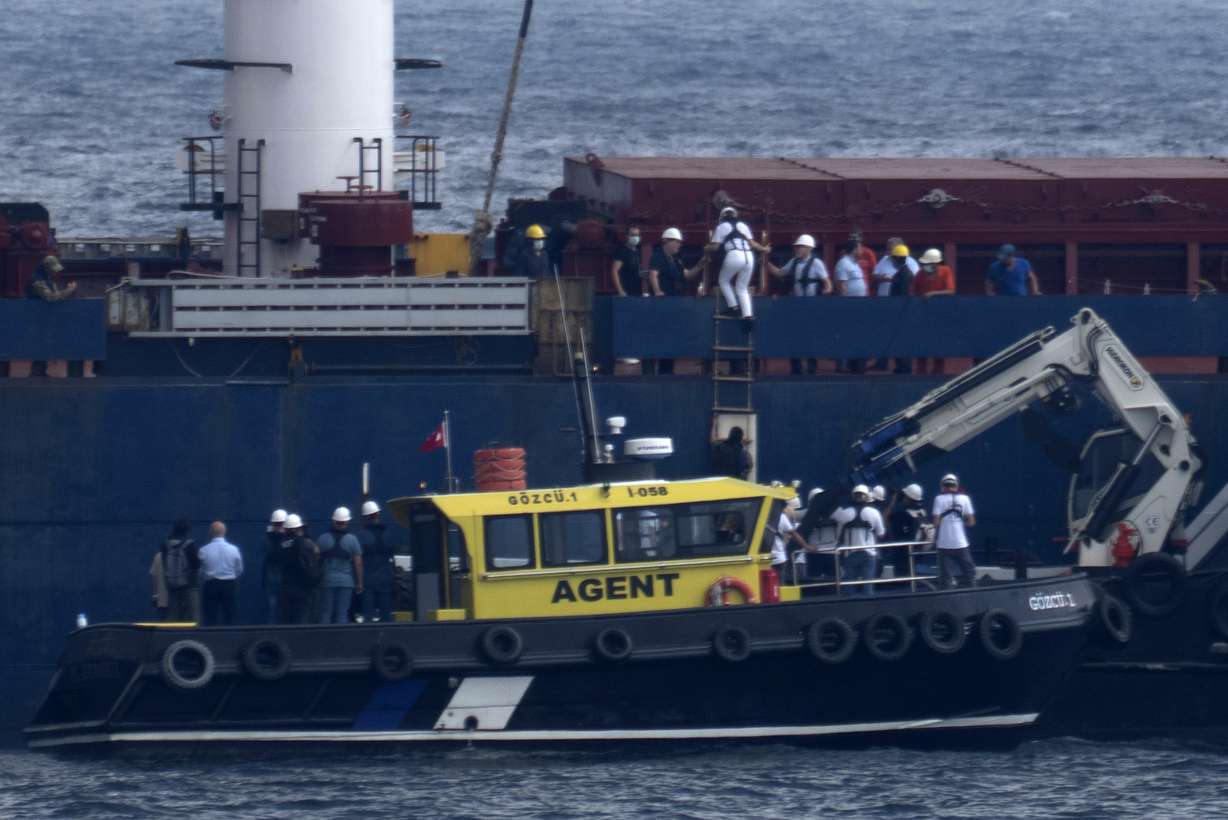 Russian, Ukrainian, Turkish and U.N. officials arrive to the cargo ship Razoni for inspection while it is anchored at the entrance of the Bosphorus Strait in Istanbul, Turkey, Wednesday.