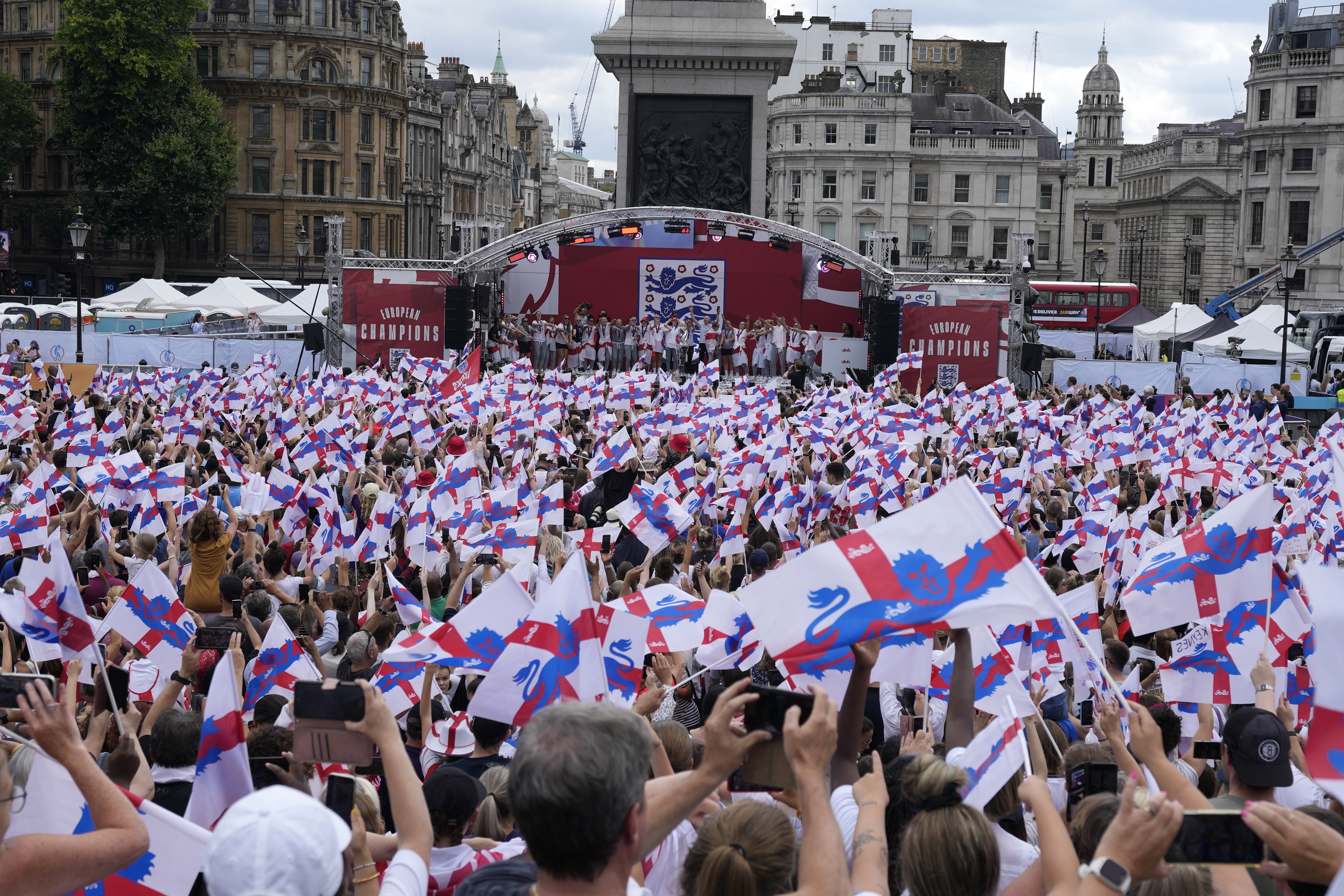 England players celebrate on stage at an event at Trafalgar Square in London, Monday, Aug. 1, 2022. England beat Germany 2-1 and won the final of the Women's Euro 2022 on Sunday. 