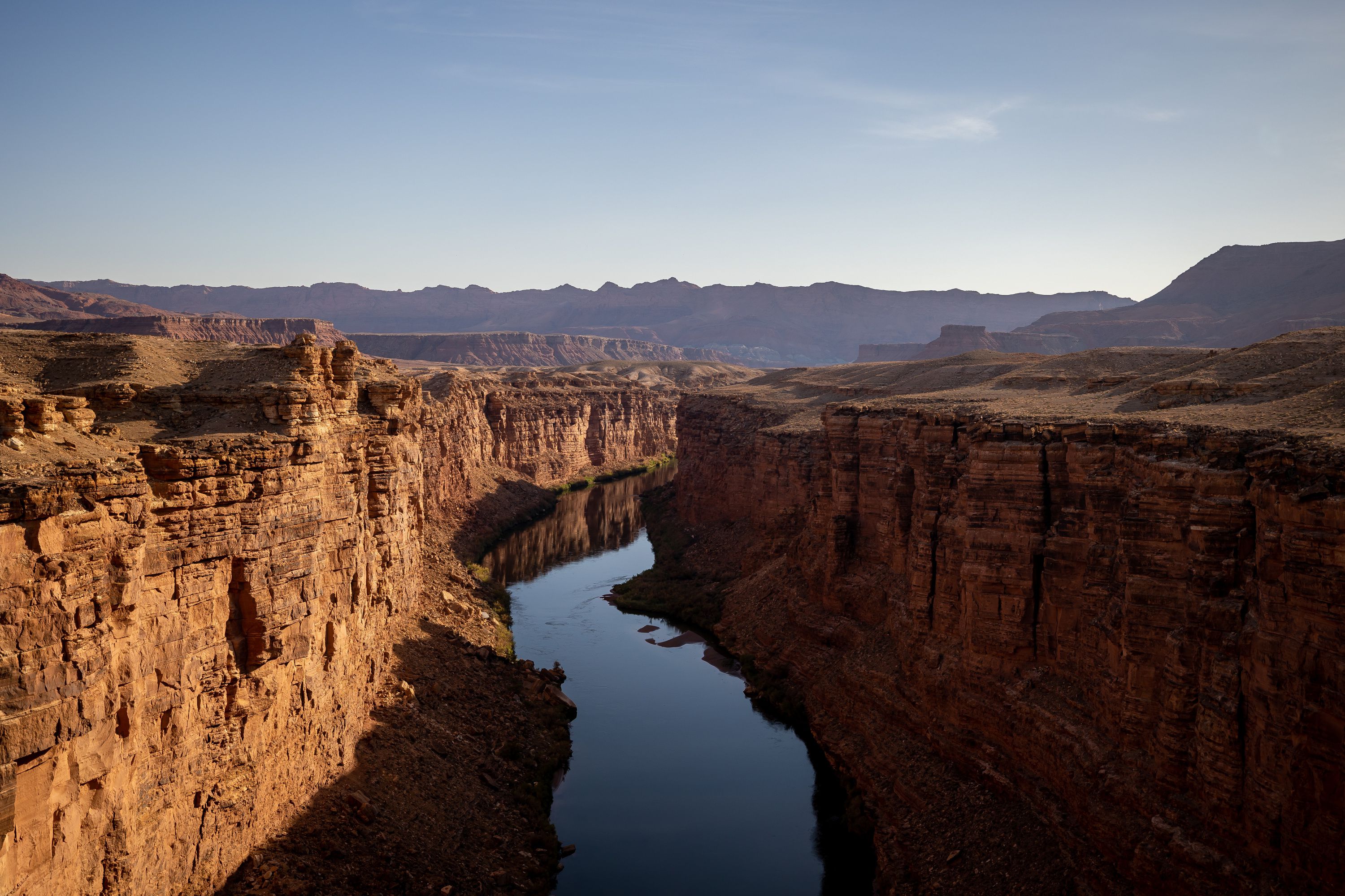 The Colorado River flows through Marble Canyon as seen from the Historic Navajo Bridge in Coconino County, Ariz., on July 20. A report released Wednesday suggests declining flows on the Colorado River are not only putting power generation at the Glen Canyon Dam at risk, but impacting the ability to deliver water to Nevada, California, Arizona and Mexico.