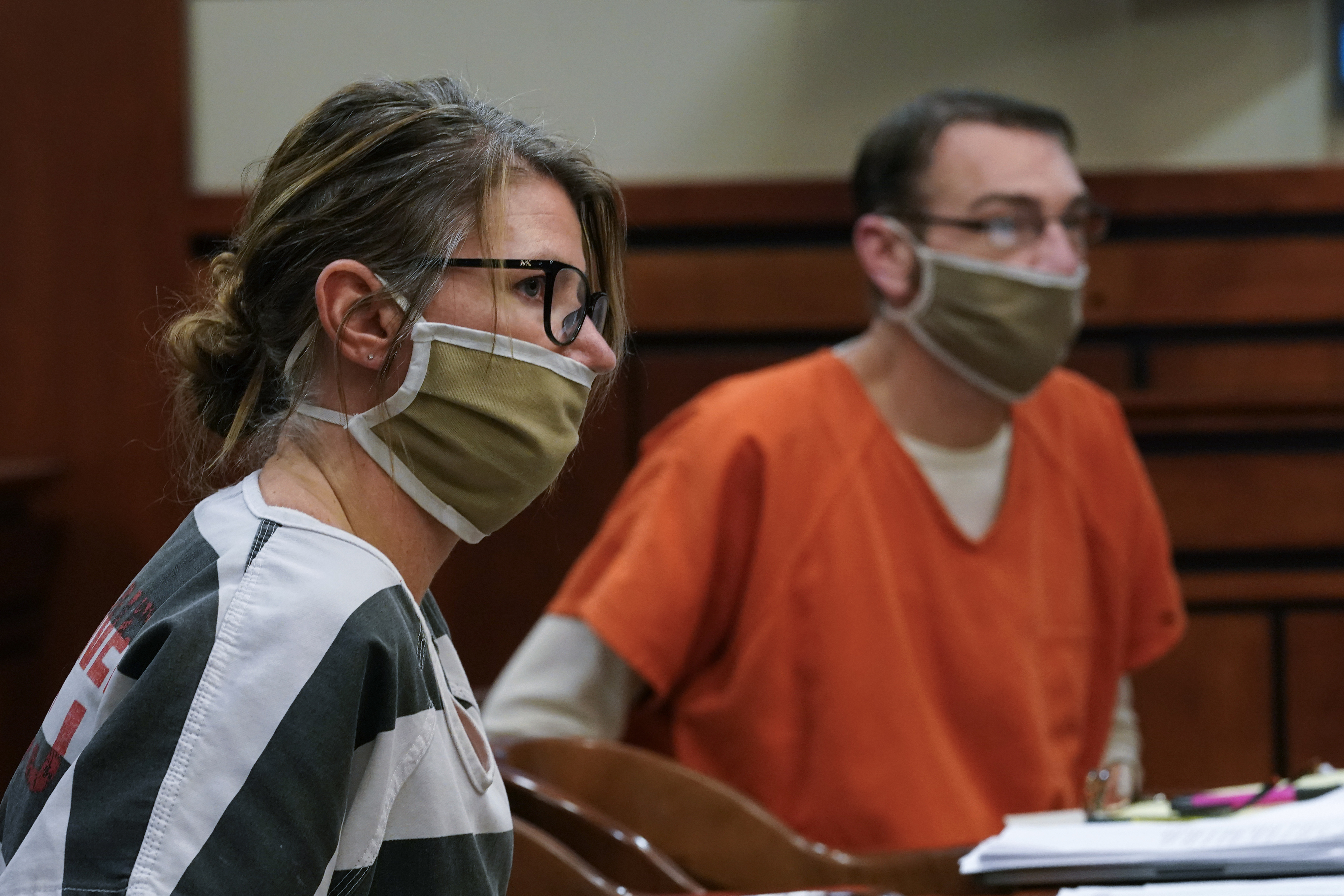 In this Feb. 8 photo, Jennifer and James Crumbley, the parents of Ethan Crumbley, a teenager accused of killing four students in a shooting at Oxford High School, appear in court for a preliminary examination on involuntary manslaughter charges in Rochester Hills, Mich.