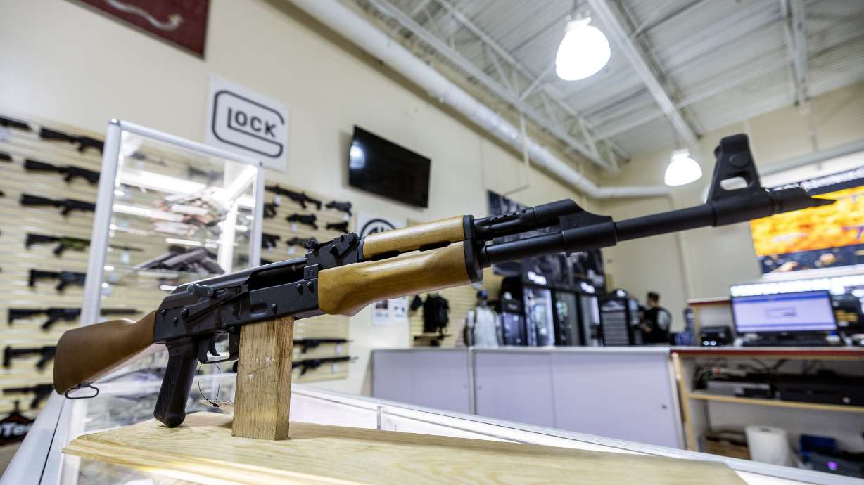 An AK-47 sits on a display stand at Impact Guns in South Salt Lake on Wednesday. According to a recent poll, 40% of Utahns say restricting access to firearms through stricter gun control laws would improve public safety.