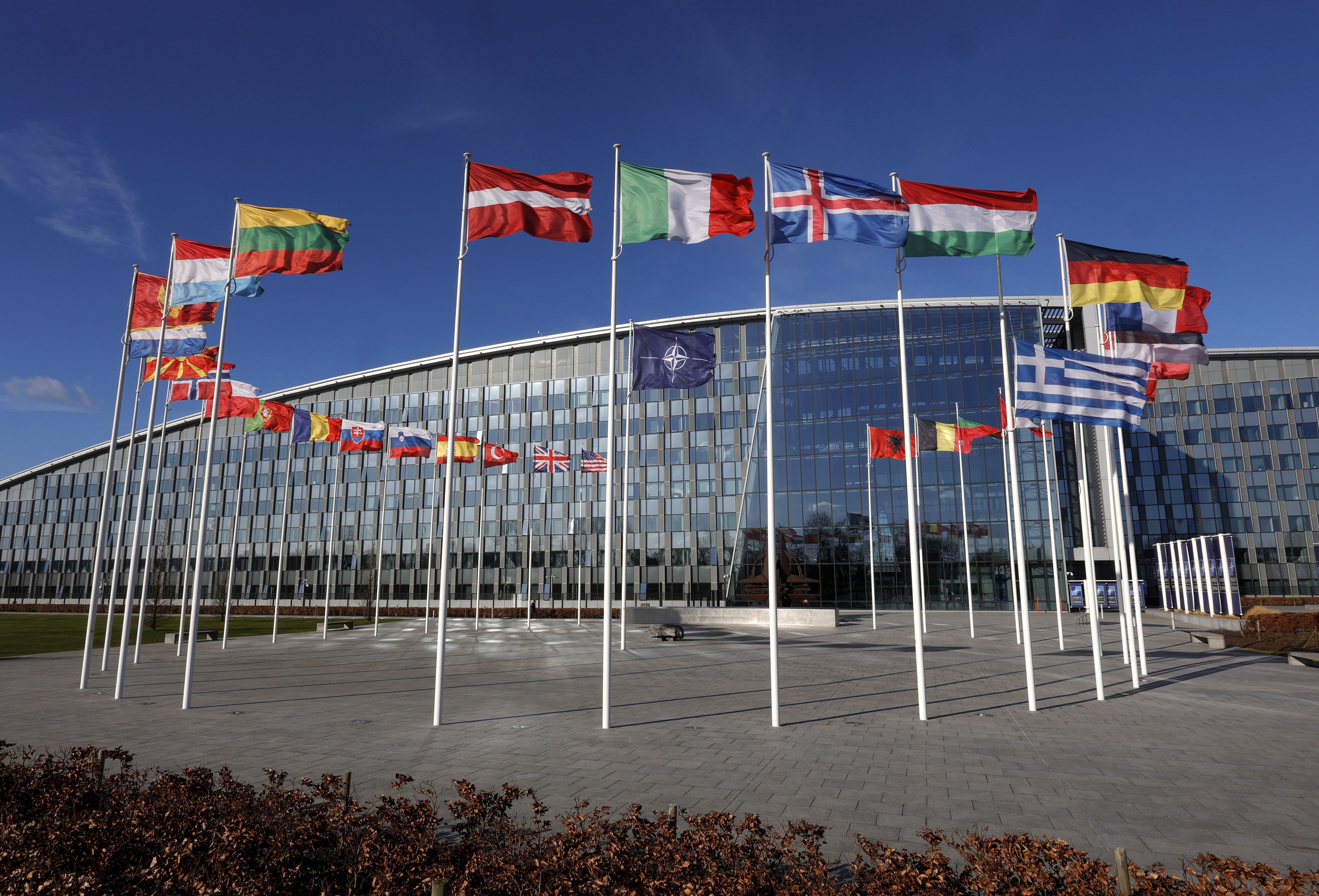 Flags flutter in the wind outside of NATO headquarters in Brussels on Feb. 7. The Senate overwhelmingly approved a resolution to ratify membership for Sweden and Finland in NATO, with Utah’s two Republican senators joining the majority.
