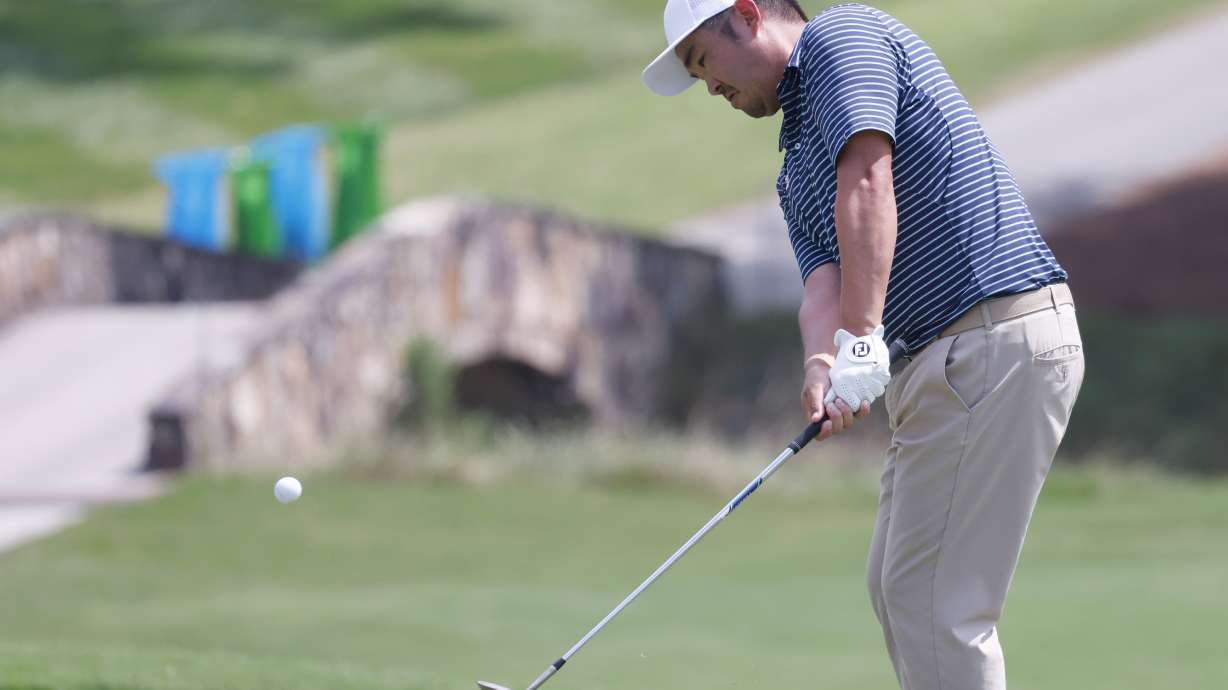 John Huh chips onto the 18th green during the first round of the Wyndham Championship golf tournament, Thursday, Aug. 4, 2022, in Greensboro, NC.
