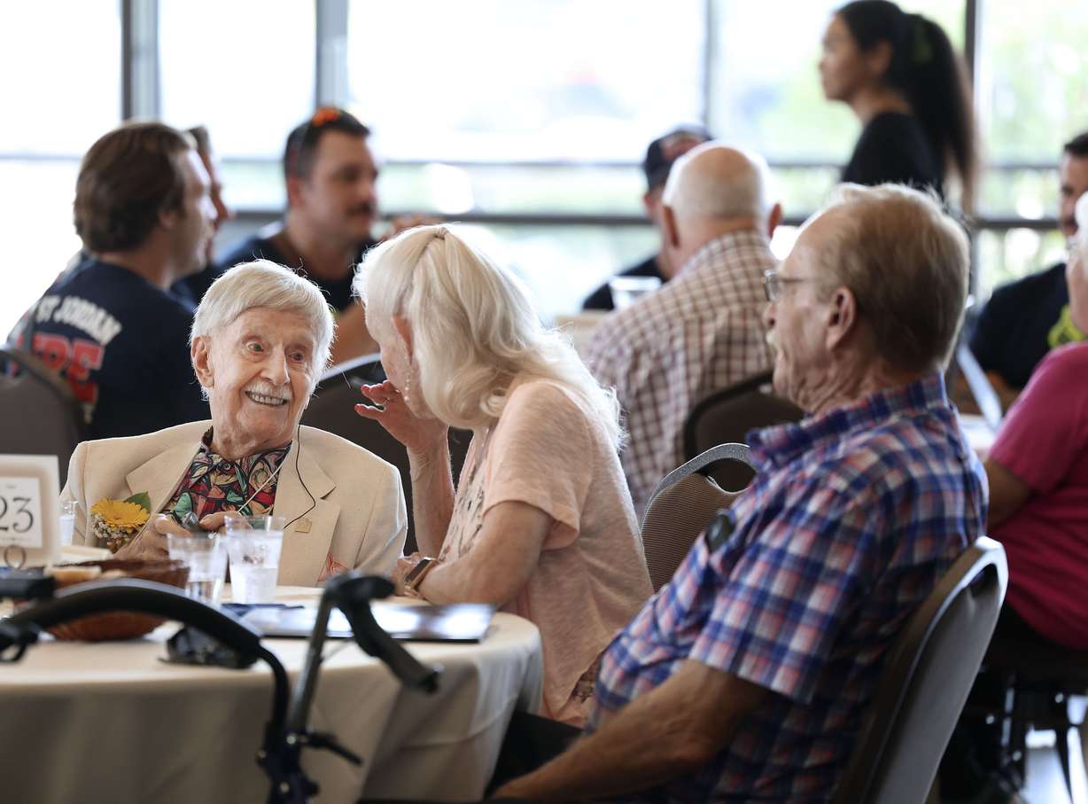 James William Broadwater Jr., 100, chats with his daughter, Jan Smith, at the 34th annual Centenarian Celebration at the Viridian Event Center in West Jordan on Thursday.