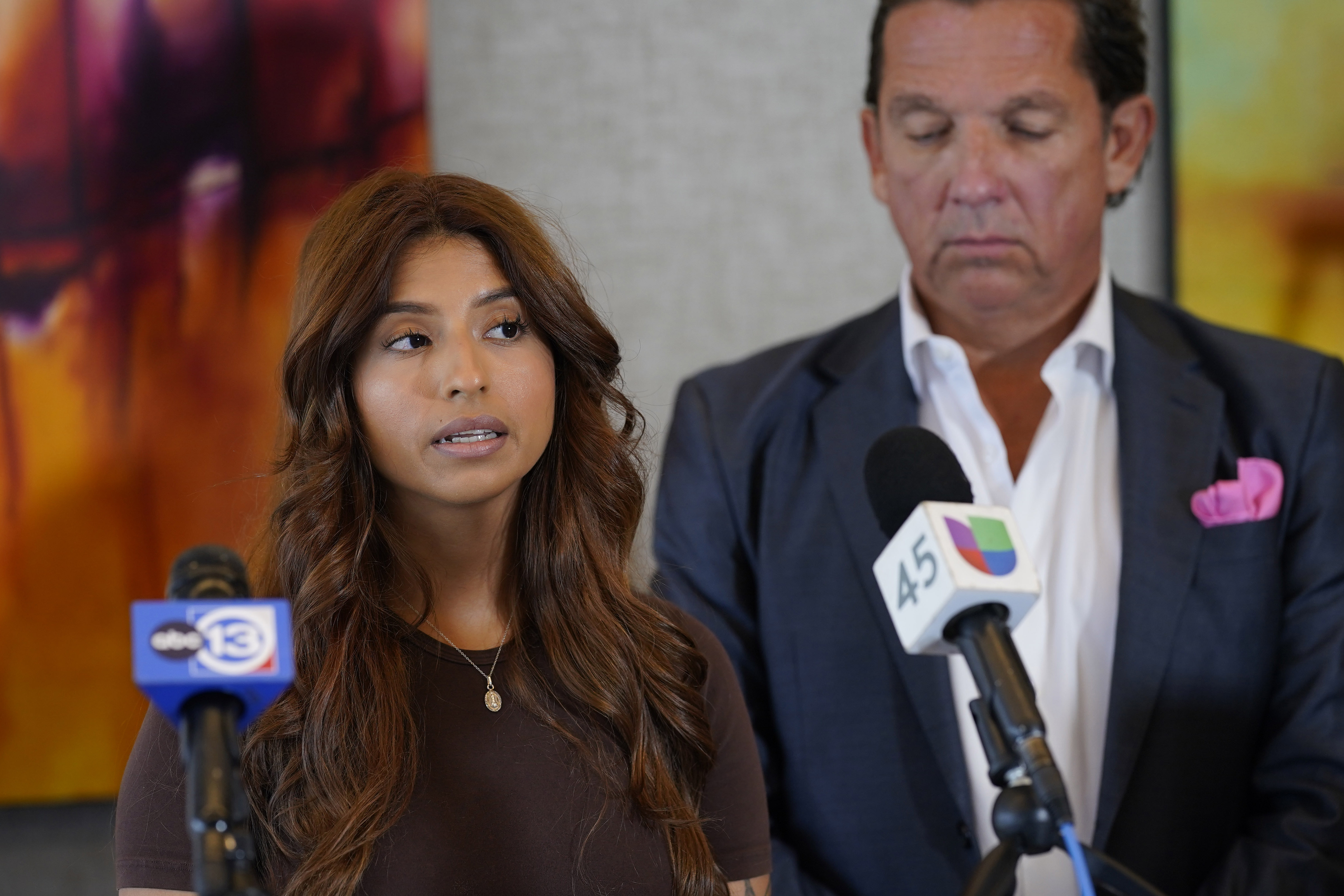 Ashley Solis, left, the first woman among several plaintiffs to file lawsuits accusing Cleveland Browns quarterback Deshaun Watson of sexual assault or harassment, speaks as her attorney Tony Buzbee stands beside her during a news conference to give an update to the lawsuits Thursday, Aug. 4, 2022, in Houston. The NFL is appealing a disciplinary officer's decision to suspend Watson for six games for violating the league's personal conduct policy. 