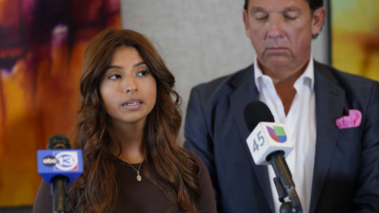 Ashley Solis, left, the first woman among several plaintiffs to file lawsuits accusing Cleveland Browns quarterback Deshaun Watson of sexual assault or harassment, speaks as her attorney Tony Buzbee stands beside her during a news conference to give an update to the lawsuits Thursday, Aug. 4, 2022, in Houston. The NFL is appealing a disciplinary officer's decision to suspend Watson for six games for violating the league's personal conduct policy.