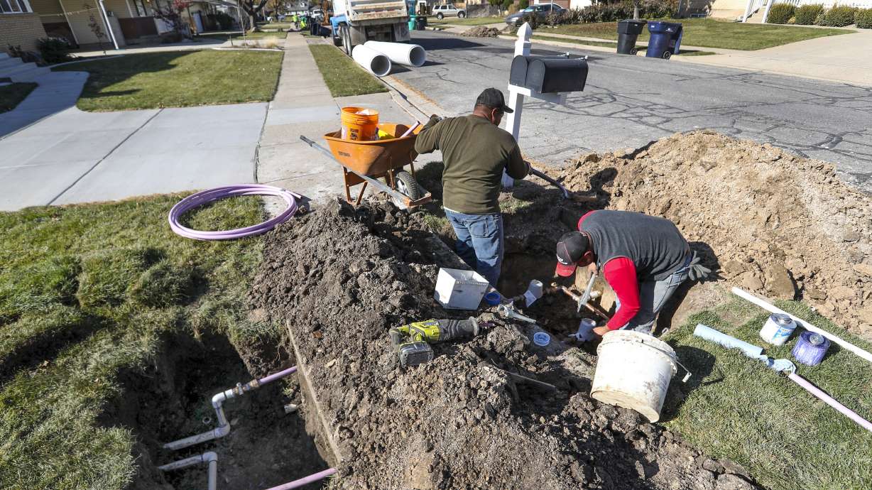 Ormond Construction crews install secondary water meters in a subdivision in Woods Cross for the Weber Basin Water Conservancy District on Nov. 7, 2019. The Board of Water Resources approved about $190 million worth of grant money to help meter secondary water across the state.