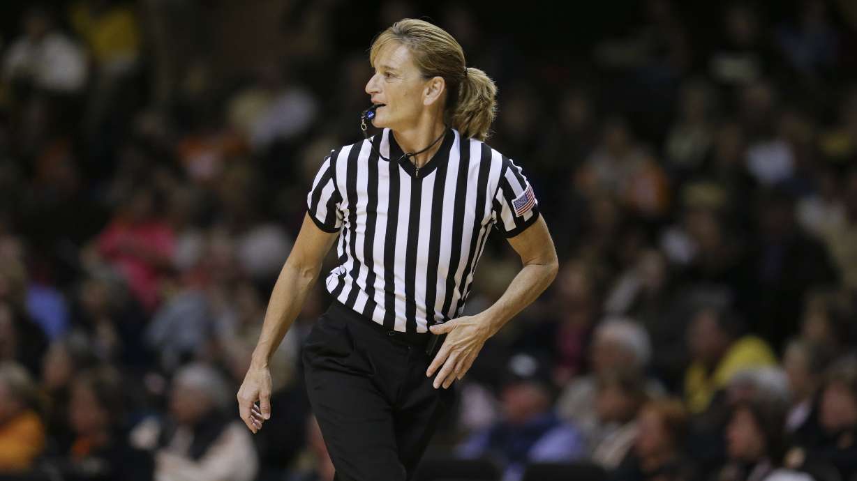 FILE - Referee Dee Kantner works in the second half of an NCAA college basketball game between Tennessee and Vanderbilt Monday, Jan. 5, 2015, in Nashville, Tenn. Kantner, a veteran referee of women’s games who works for multiple conferences, finds it frustrating to have to justify equal pay. “If I buy an airline ticket and tell them I’m doing a women’s basketball game they aren’t going to charge me less,” she said.