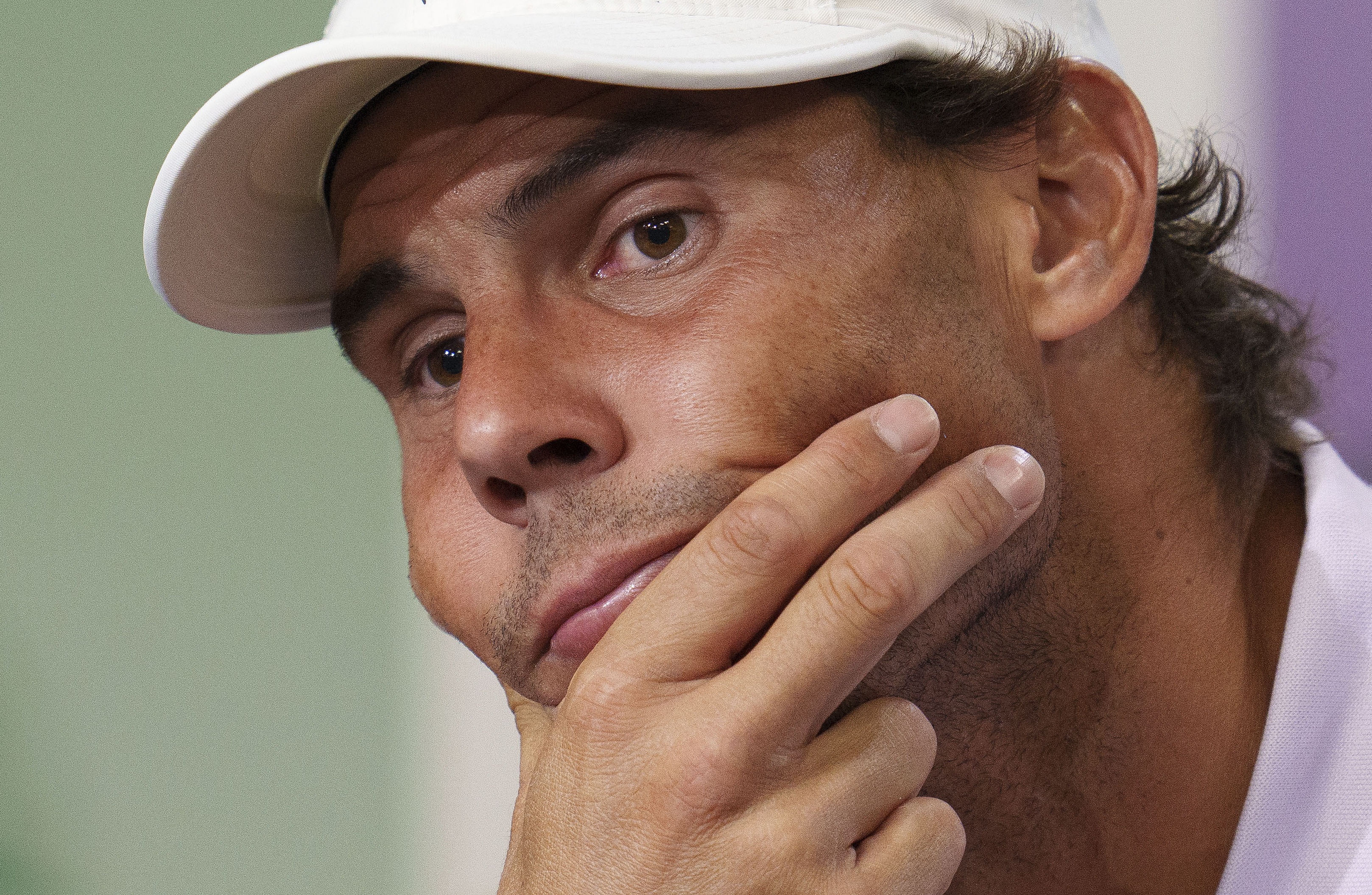 Spain's Rafael Nadal announces that he is withdrawing from the semi-final of the Gentlemen's Singles during a press conference at The All England Lawn Tennis Club, Wimbledon, Thursday, July 7, 2022. Rafael Nadal withdrew from Wimbledon on Thursday because of a torn abdominal muscle, announcing his decision a day before he was supposed to play in the semifinals. 