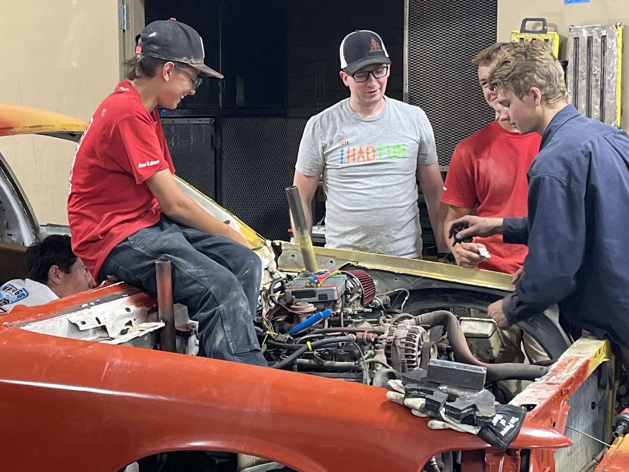 Some classmates from Maple Mountain High School in Spanish Fork spent the summer learning all about cars. Mechanic Tyler Warner donated cars for them to work on, which will be part of a demolition derby Aug. 13.