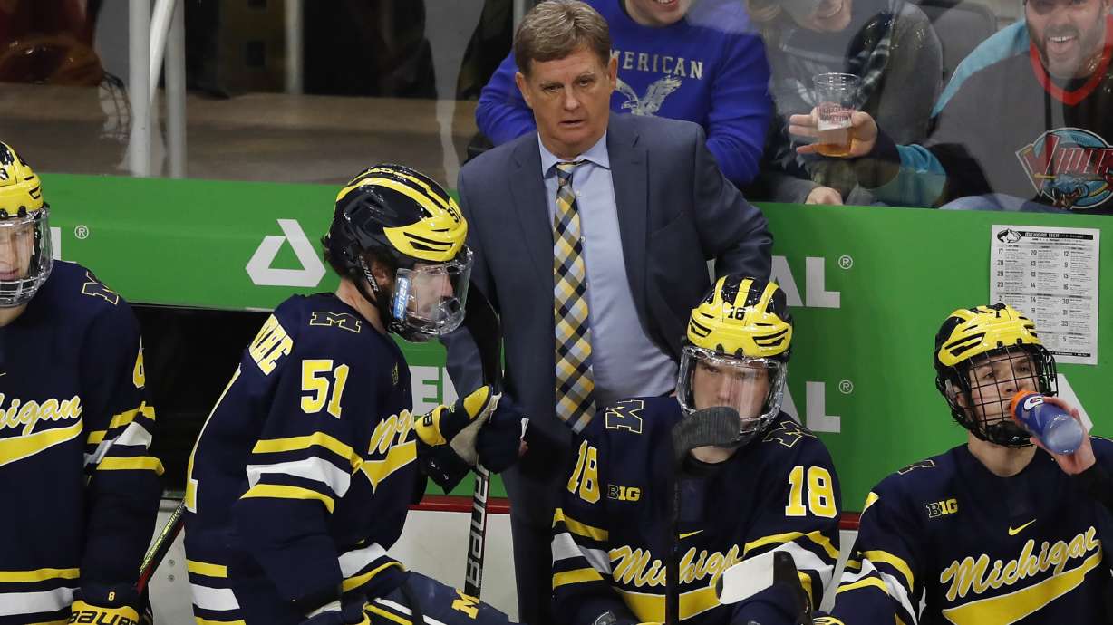 FILE - Michigan hockey coach Mel Pearson is seen during the second period of the Great Lakes Invitational college hockey championship game, Tuesday, Dec. 31, 2019, in Detroit. The University of Michigan has cut ties with hockey coach Mel Pearson. The school announced its decision on Friday, Aug. 5, 2022 Pearson's contract expired after last season and he had been an at-will employee, pending a review of the program.