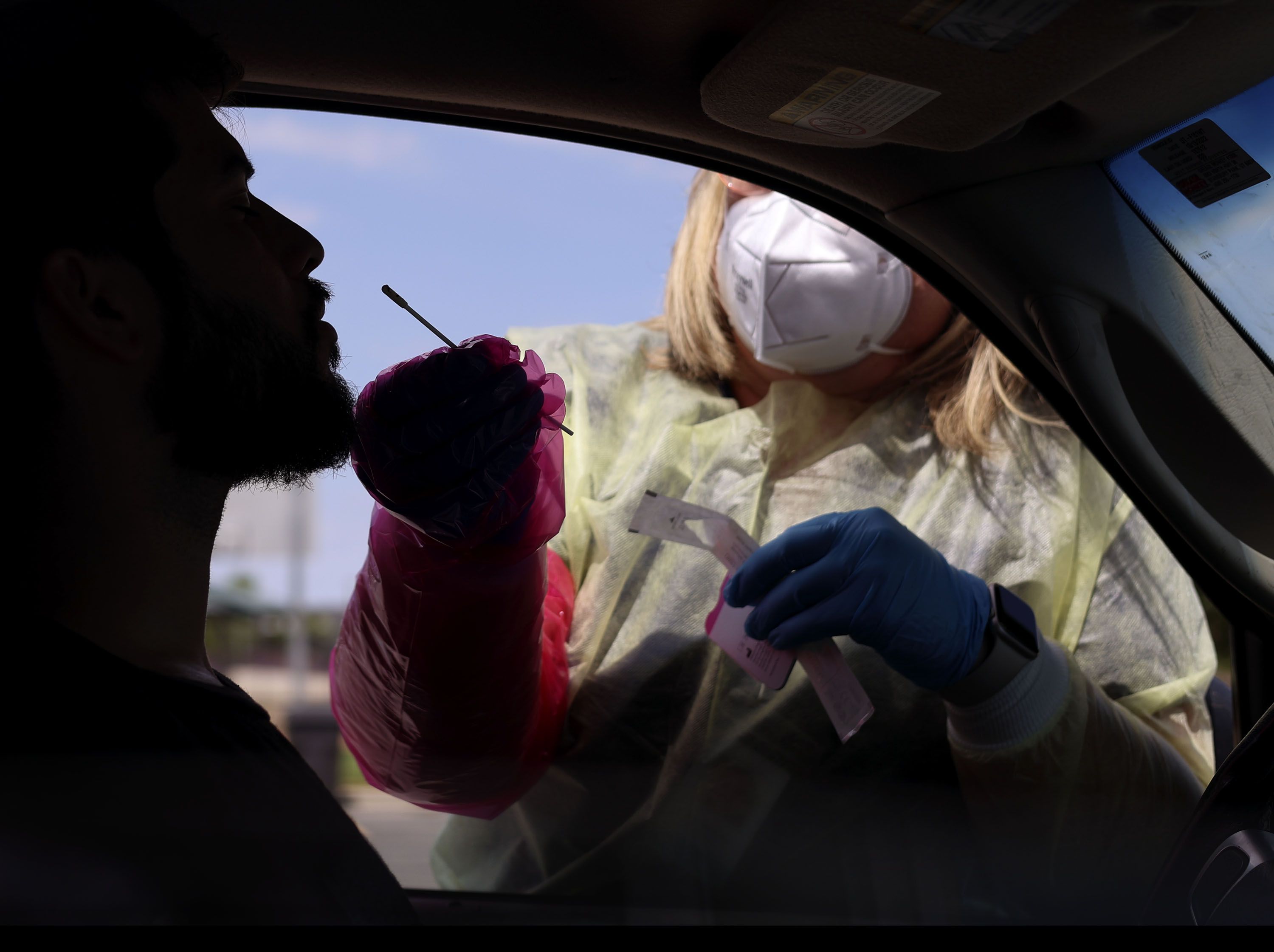 BreAnne Anderson, a registered nurse, administers a COVID-19 test at a Nomi Health test site at Centennial Park in West Valley City on Friday. A new version of the omicron variant that may be the best yet at evading immunity from vaccinations or previous infections has been spreading in Utah for at least two months.