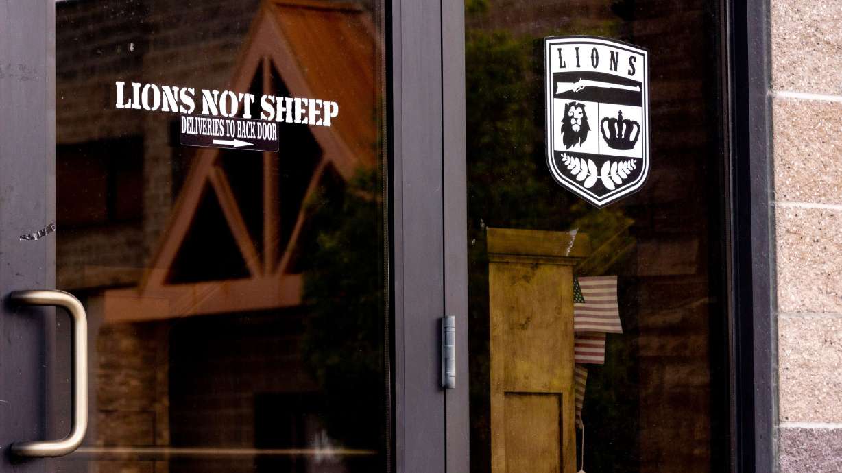 Lions Not Sheep logo is printed on the front doors at its storefront in Bluffdale on Friday. The Utah-based apparel company known for its inflammatory T-shirts that often espouse pro-Second Amendment and pro-Trump messages was ordered to pay a hefty fine for falsely claiming some its products were made entirely in the U.S.