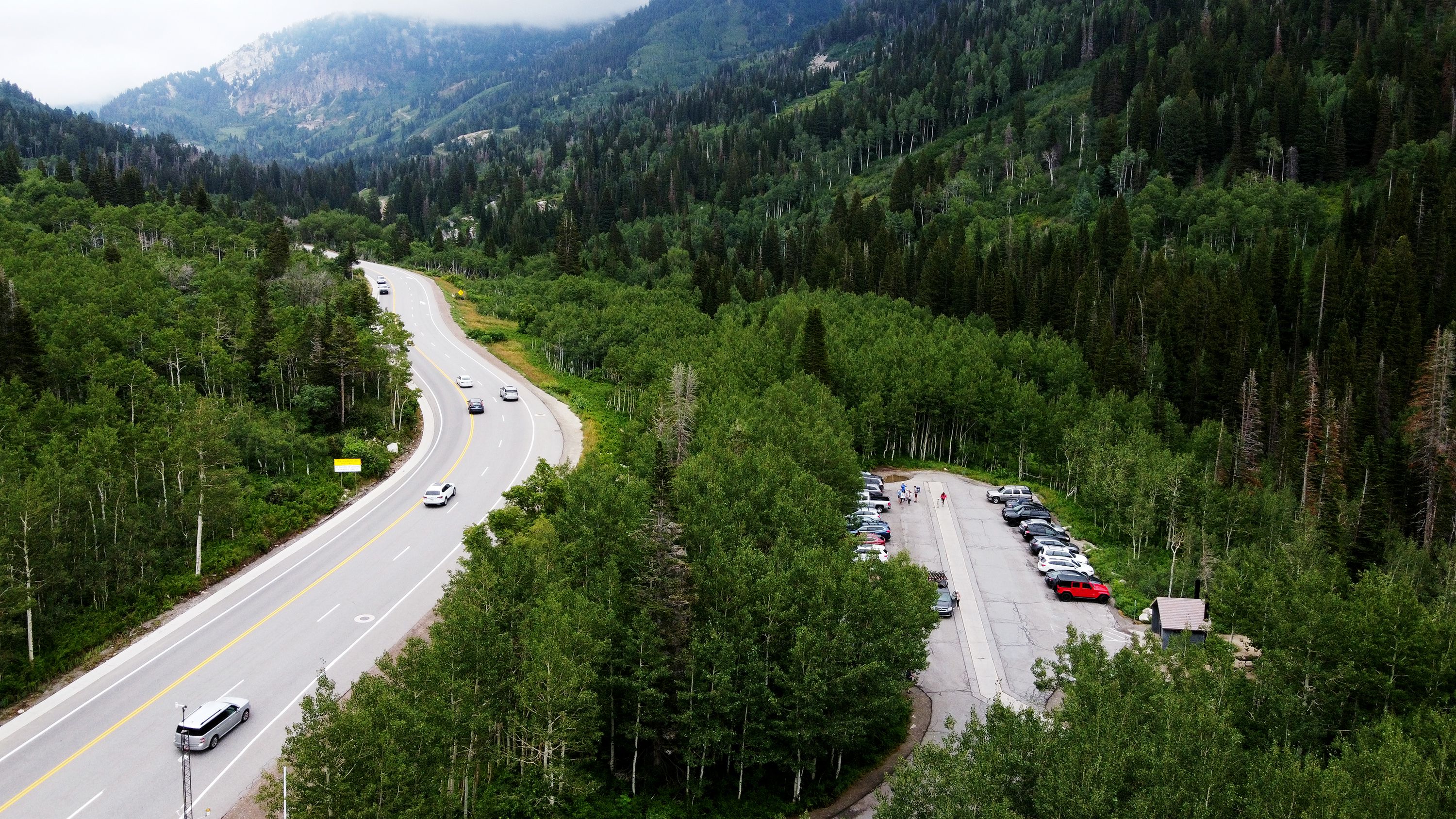 Cars are parked in the parking lot of the White Pine Trail in Little Cottonwood Canyon on Tuesday. The Forest Service is proposing fees for a number of trails in the Uinta-Wasatch-Cache national forest.